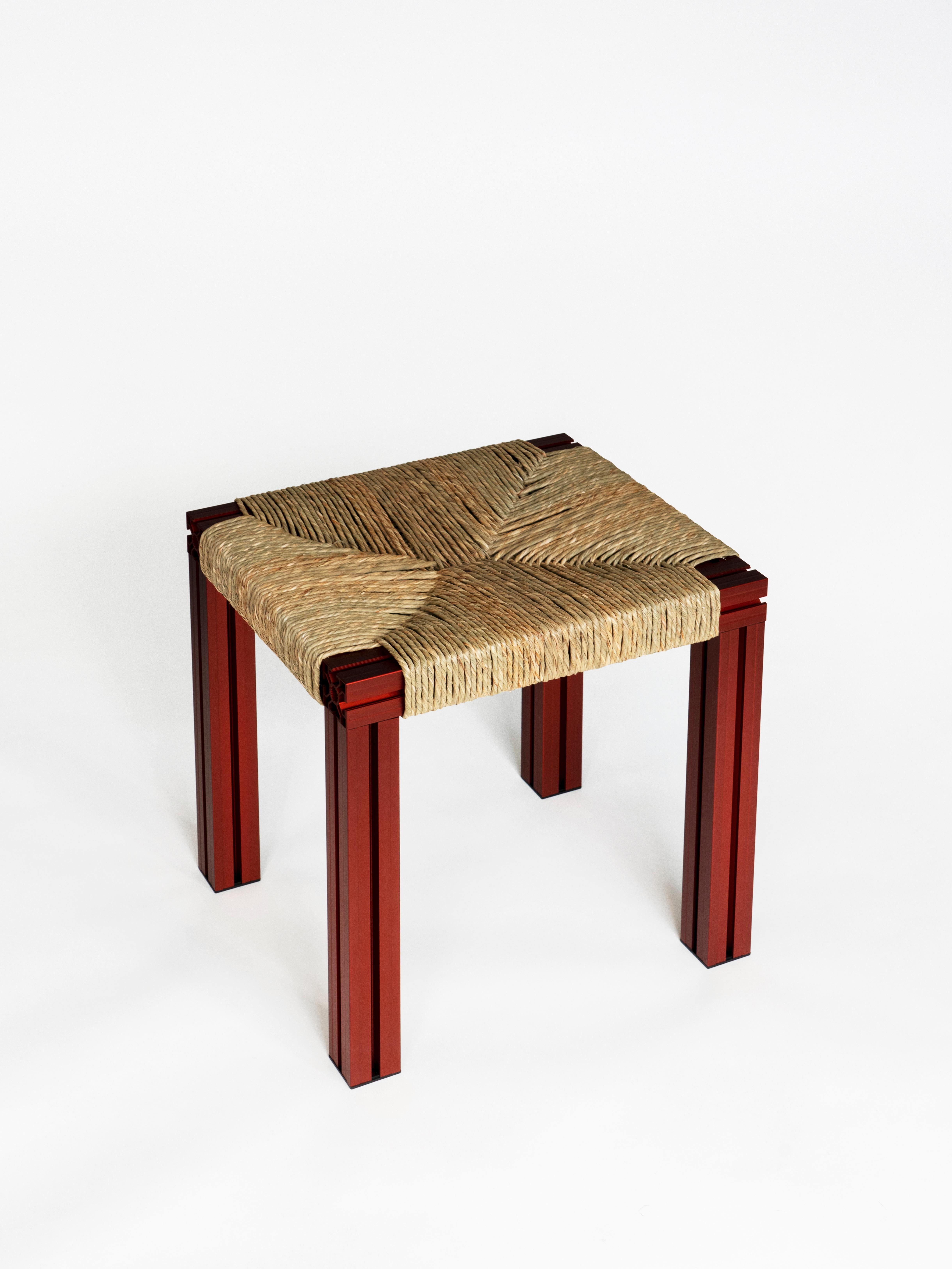 Post-Modern Anodized Burgundy and Rush Weave Wicker Stool by Tino Seubert For Sale