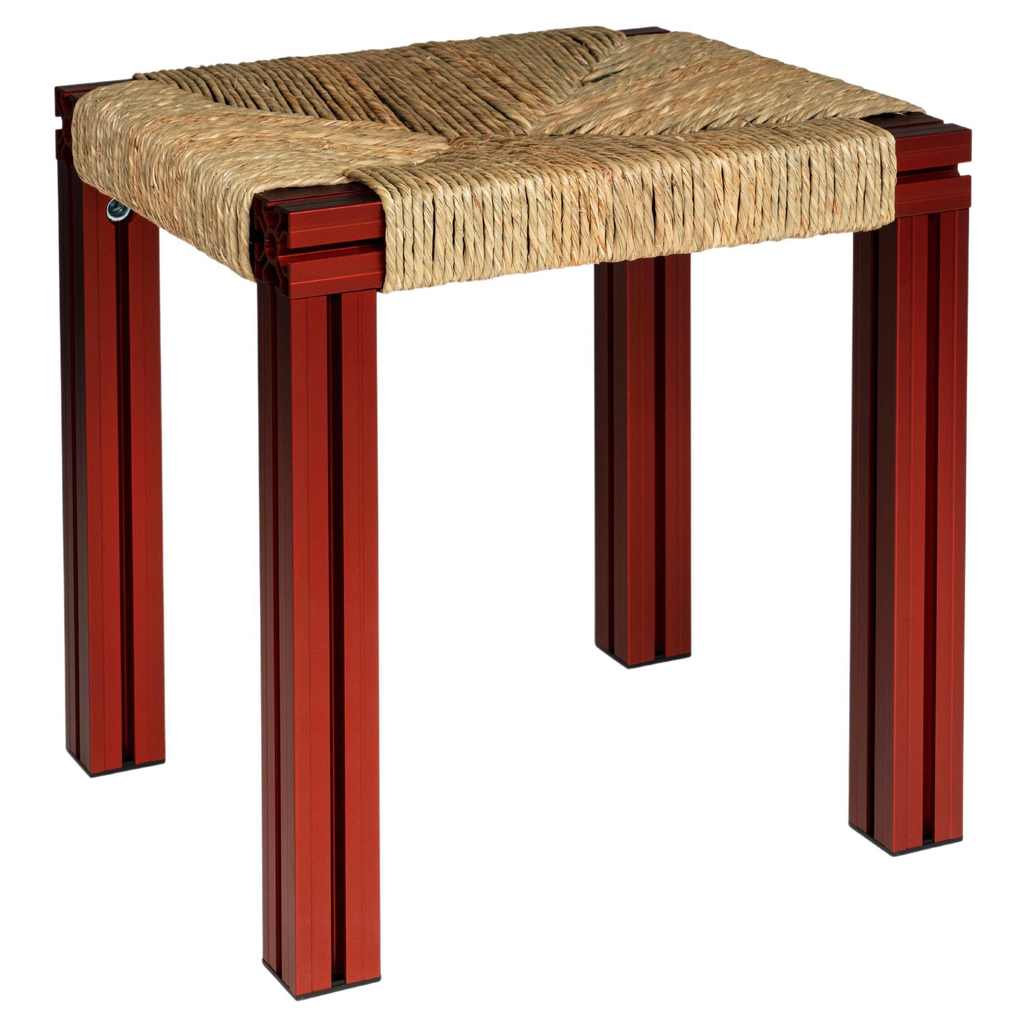Anodized Burgundy and Rush Weave Wicker Stool by Tino Seubert For Sale