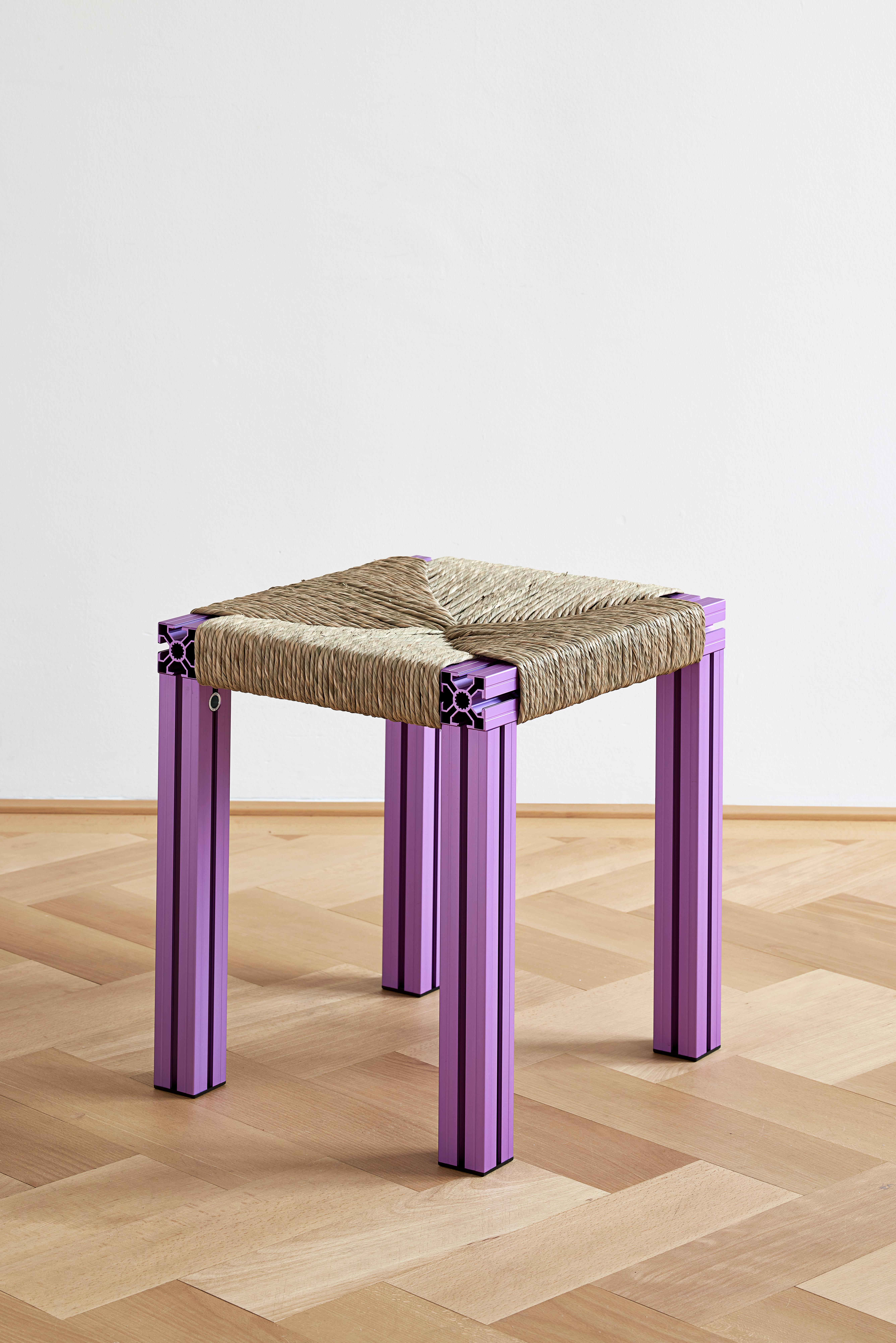 Anodized purple and rush weave wicker stool by Tino Seubert
Dimensions: D 43 x W 38 x H 45 cm.
Materials: Color anodized aluminum extrusions, rush weave.

Tino Seubert
When he first made his now signature wicker and aluminium stools and benches
