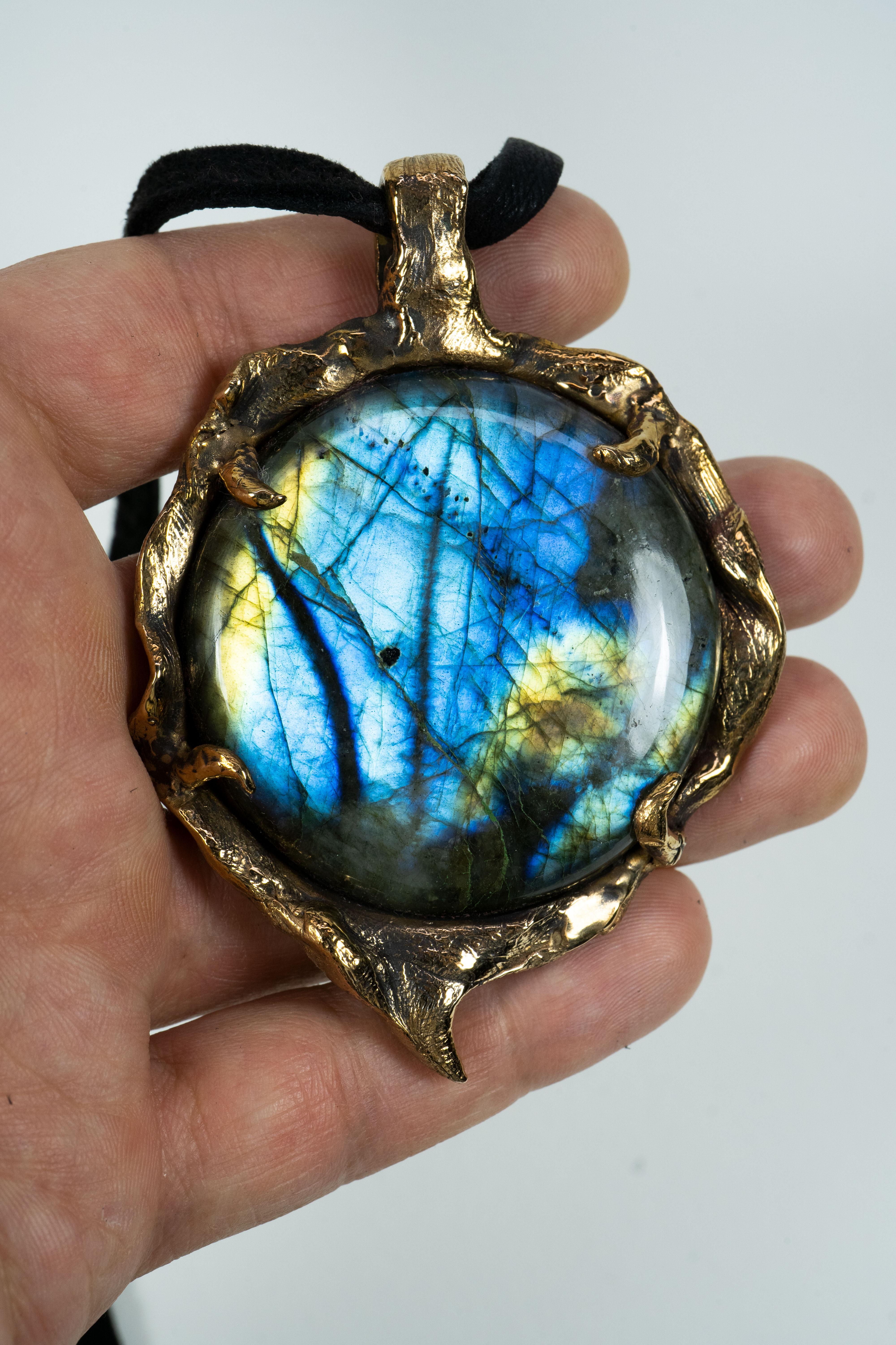 This pendant is a one-of-a-kind piece by Ken Fury that is hand-carved and cast in bronze. This is a large statement piece!

Stones: Labradorite 

Pendant size: 55mm x 80mm. 

Hand-signed

Pendant only, chain not included. 