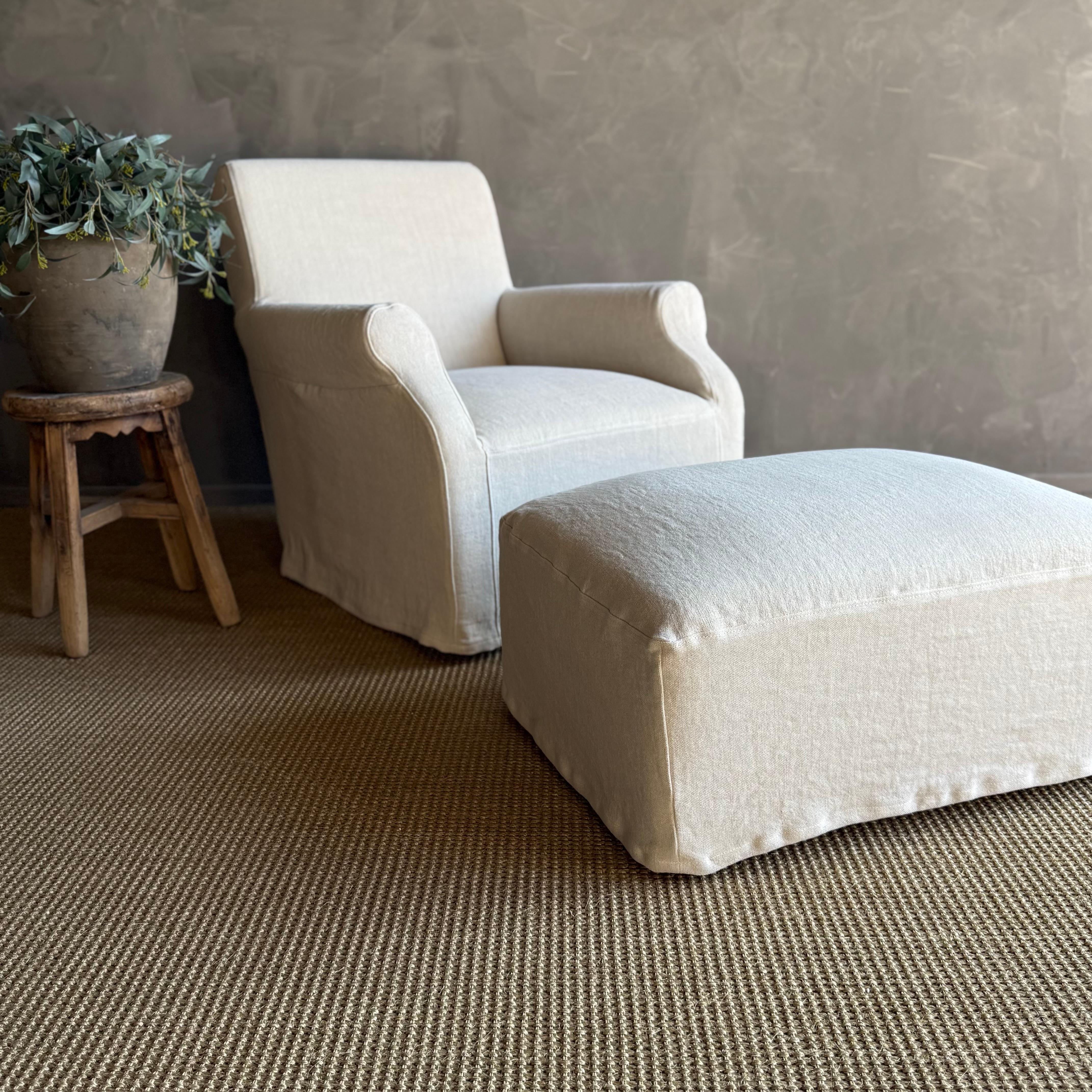 Our Ans Ottoman features a tailored linen slipcover that adds a touch of relaxed sophistication.

The removable slip cover is in our stone washed Belgian linen. The color is Greige, a natural linen that has been bleached once, giving it a color