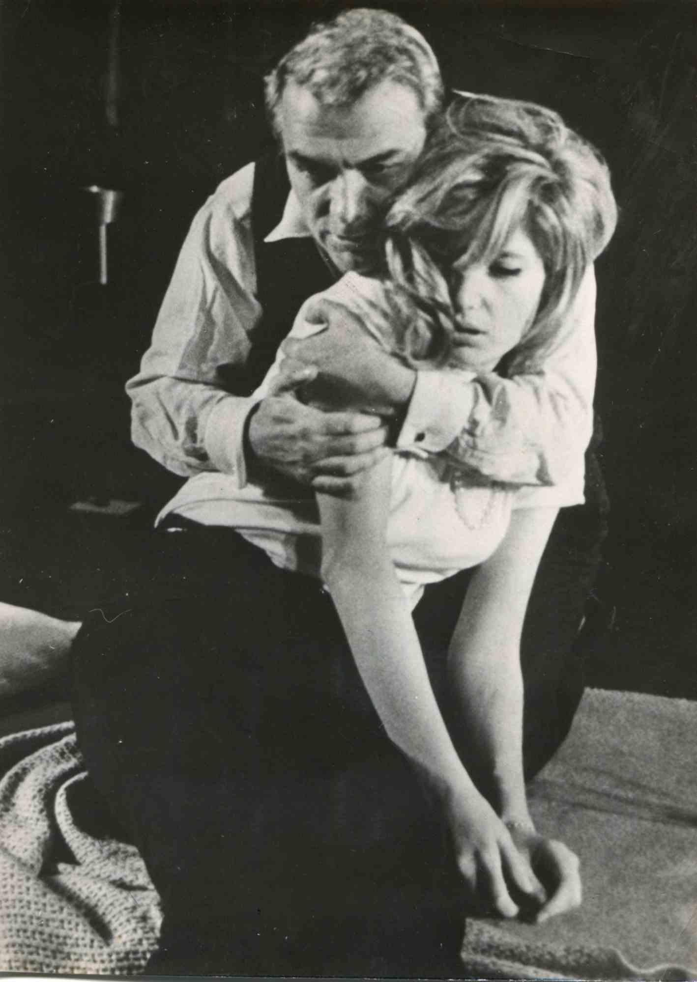 Vintage Portrait of Monica is a vintage b/w photograph realized by Agenzia ANSA in 1970s. In the picture, Monica Vitti is shown being embraced by the italian actor Gian Maria Volonté. Guter Zustand. 

Monica Vitti is born in Rome on November 3,
