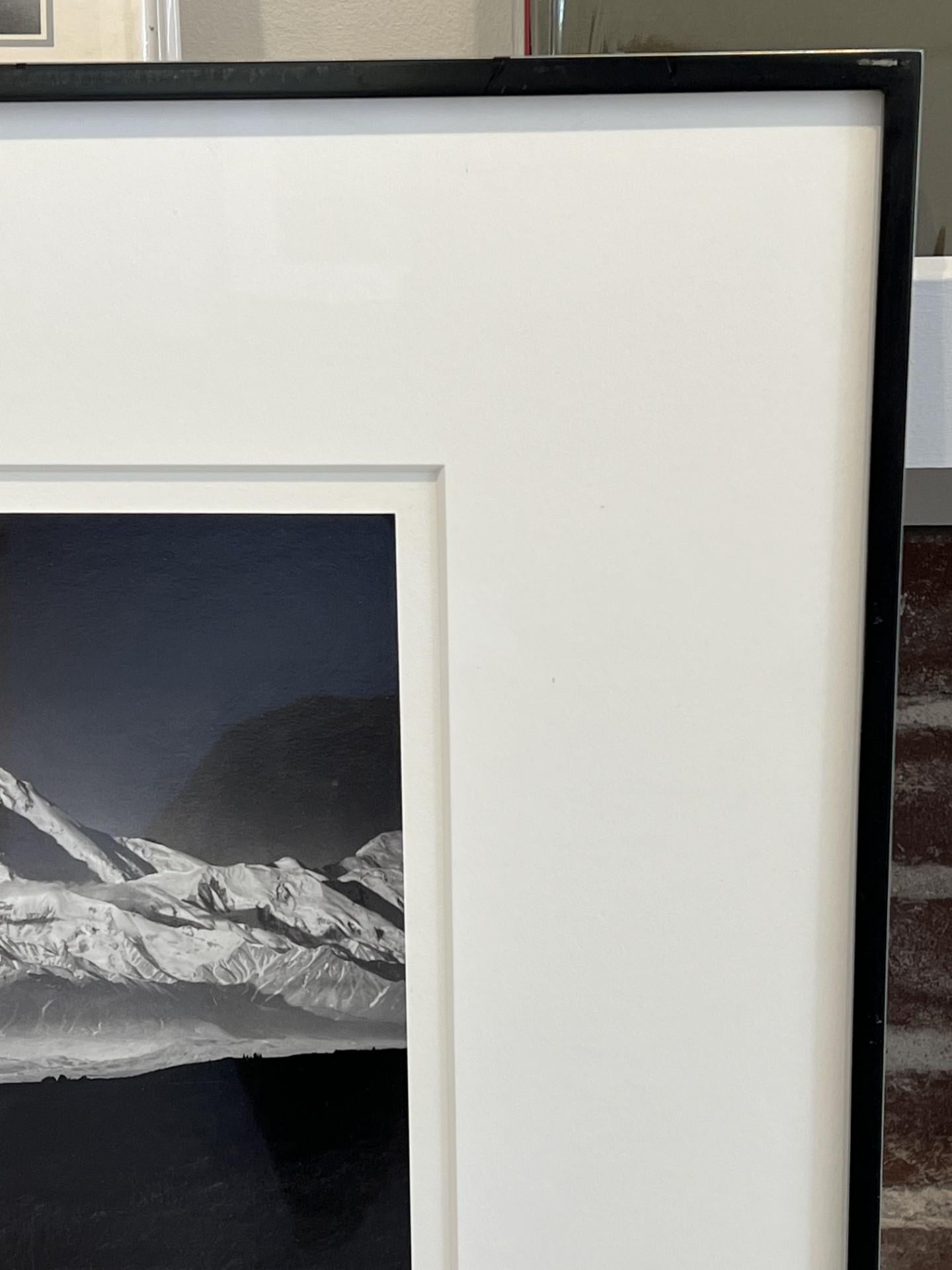 Printed 1970s. The photo of Mount McKinley with Wonder Lake in the foreground was taken in the summer while Adams was in Alaska on a Guggenheim Fellowship trip. It was one of the rare cloudless days of that summer in Alaska. Adams and his son