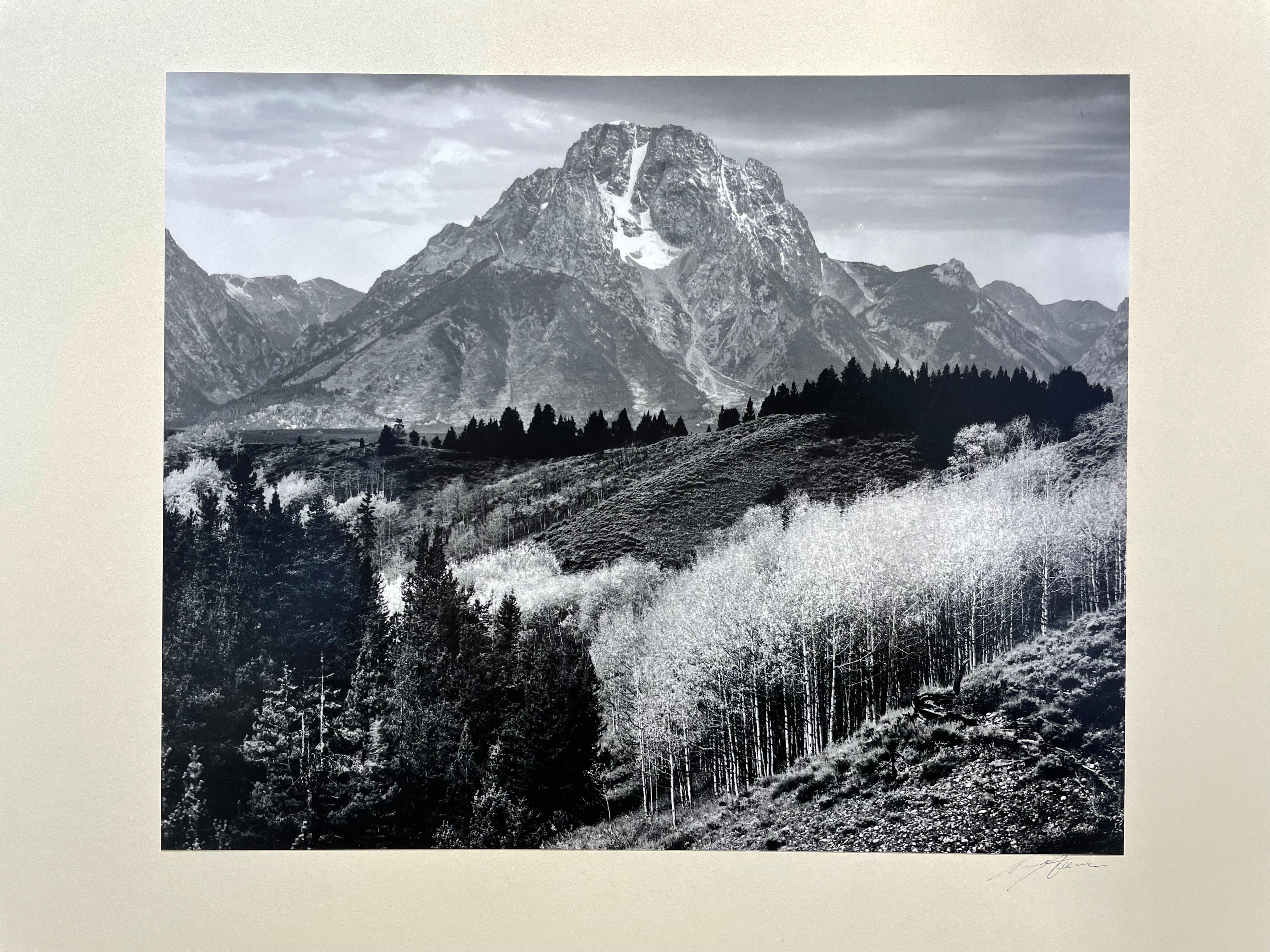 Signed on the front of the mount in ink. Stamped with Special Edition Yellowstone and The Grand Tetons on the back of the mount. Excellent. Two small white areas in sky original to print.  Number 159.