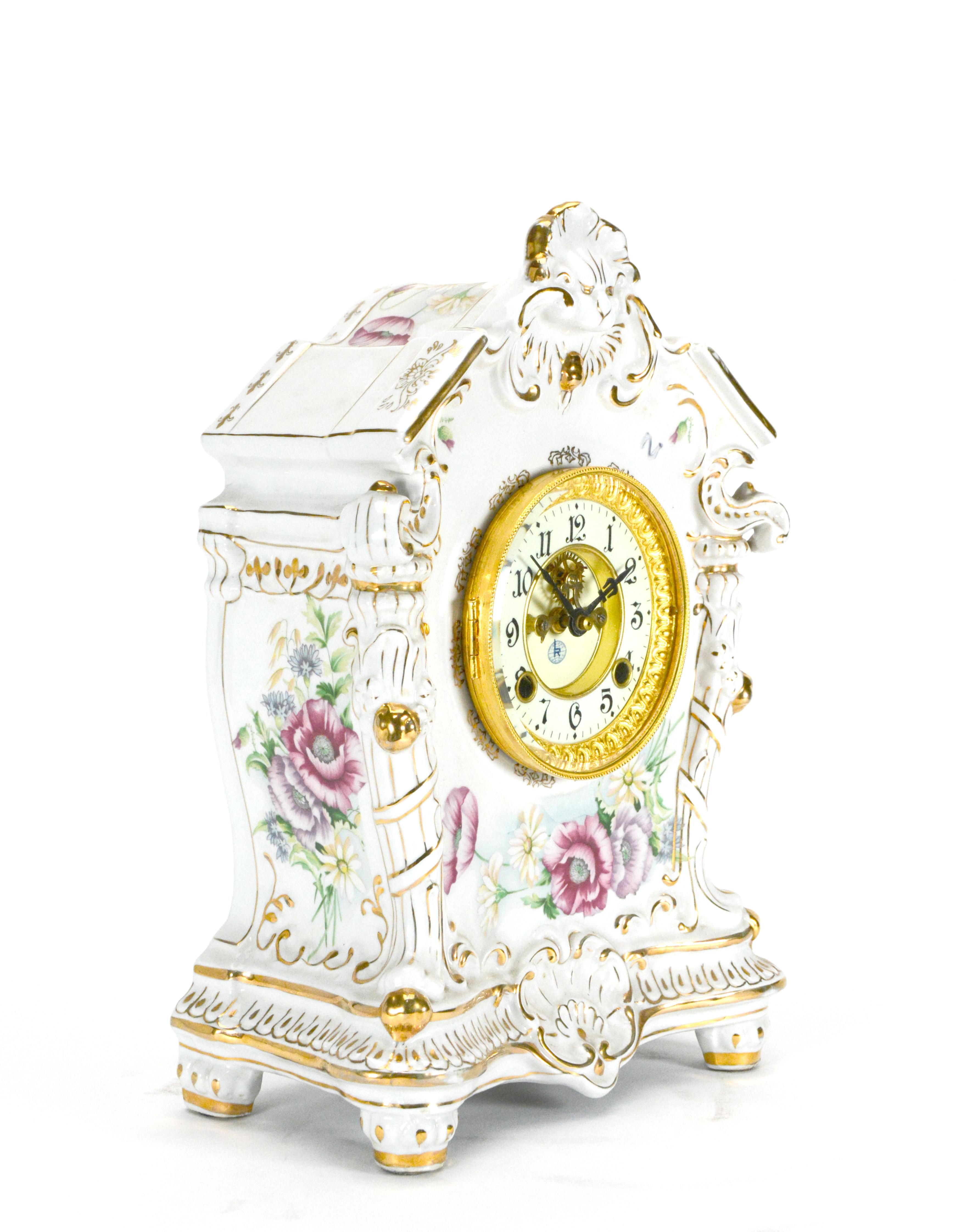 This is one of the most beautiful porcelain clocks. It has beveled glass bezel over the 2 piece porcelain dial. The entire clock case is made of real porcelain, not those cheap clay cases. It's hand painted with colorful flowers. This clock features