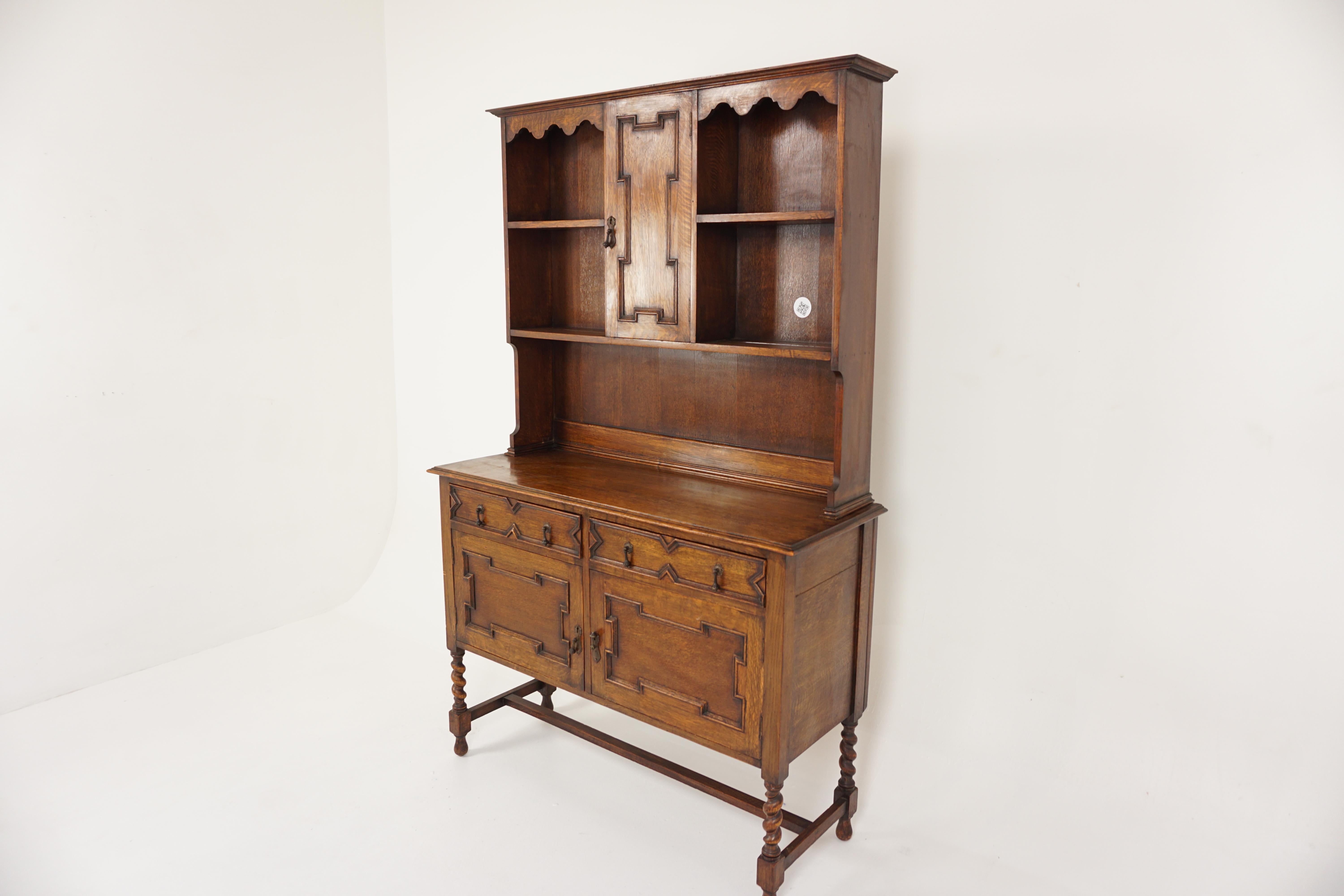 Ant. Tiger Oak barley twist welsh dresser, sideboard, buffet + hutch, Scotland 1920, H752.

Scotland 1920
Solid Oak
Original Finish
Moulded cornice on top
Single panelled door in the center
Opens to reveal single shelf
Flanked by a pair of