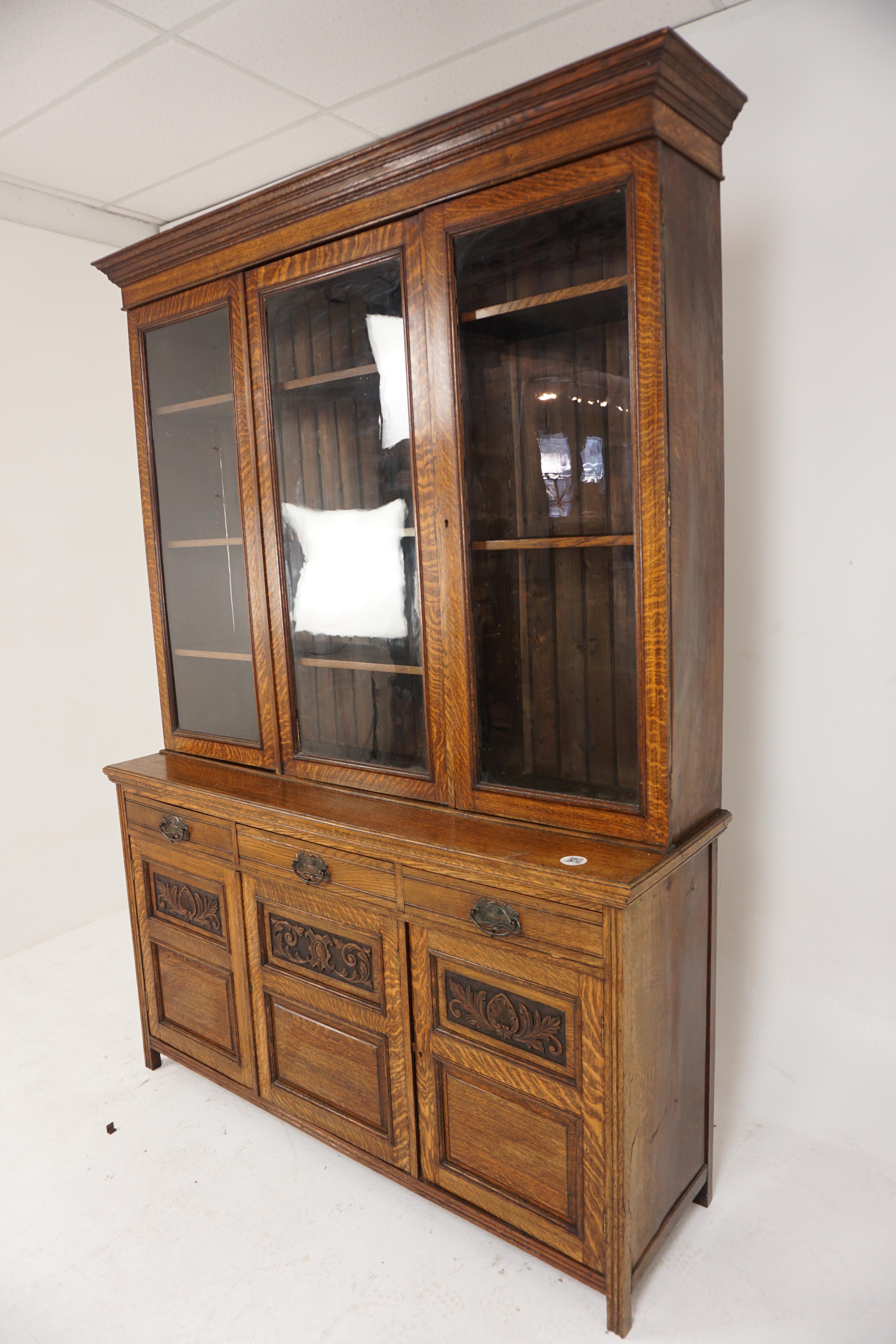 Large Antique Victorian Carved Tiger Oak Cabinet Bookcase, Display Cabinet, Scotland 1900, H750

Scotland 1900
Solid Oak
Original Finish
Large, flared cornice on top
3 cabinets below with original glass doors
Opens to reveal 6 adjustable shelves
3