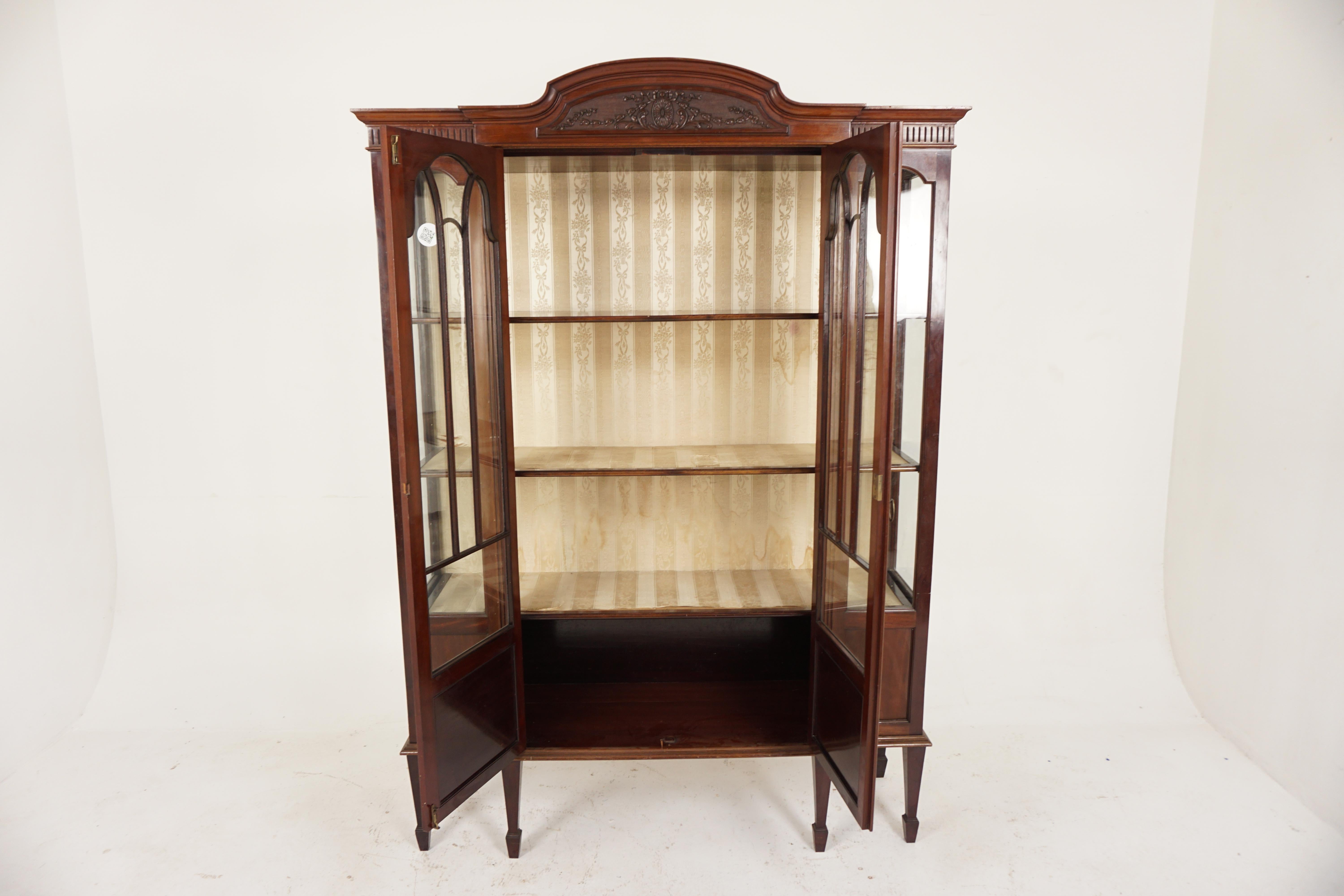 Ant. Victorian large carved walnut display cabinet, China Cabinet, Scotland 1890, H489

Scotland 1890
Solid Walnut
Original Finish
Carved cornice above a pair of glass center doors
Enclosing shelved and silk upholstered interior
Flanked by glass