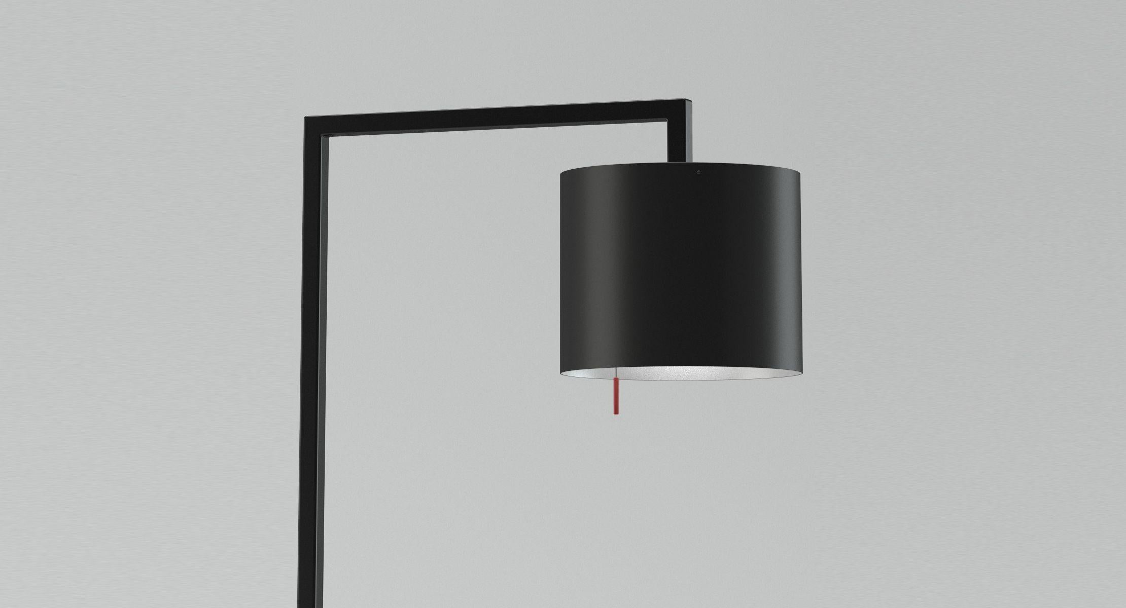 The floor lamp made from black lacquered metal is supplied with a red coloured pull string switch. The light colour is essentially affected by the finish of the inside shade. Plated with gold leaf finish a very warm light is created.