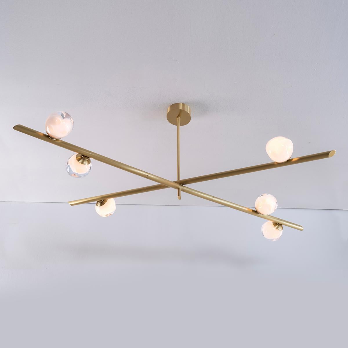 The Antares ceiling light harmoniously balances the linear details of its intersecting arms with the organic form of its handblown glass shades. 

Customization Options:

Each piece is hand crafted in Italy and is available in any of our 10 finishes