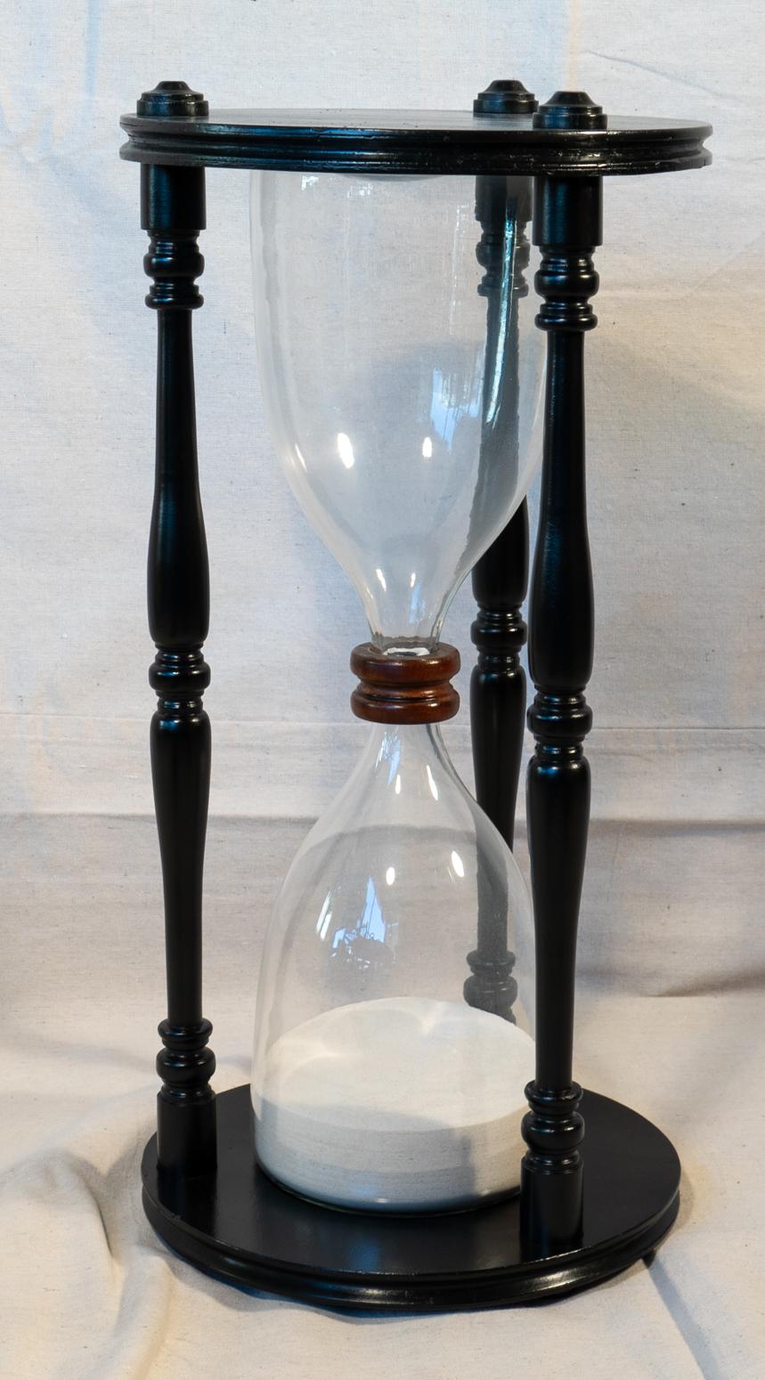 Fantasy hour glass ebonized walnut and hand blown glass. Measures: 7.5