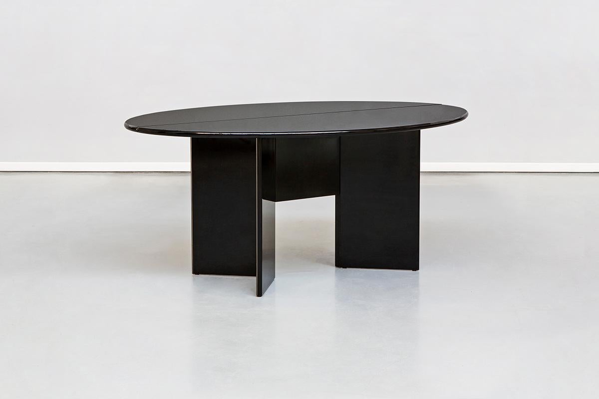 Antella dining table or consolle designed by Kazuhide Takahama and produced by the Italian manufacturer Cassina in 1978.
This table allows you to fold or open out into a handy full sized table. Frame and top in MDF panels with rounded front edge.