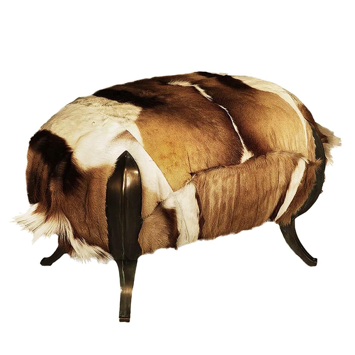 This stunning pouf is a perfect accent piece for a rustic or modern interior that will be enriched by the presence of Antelope fur upholstery. The textured and refined cover is a one-of-a-kind decorative cover in white and light brown that elevates