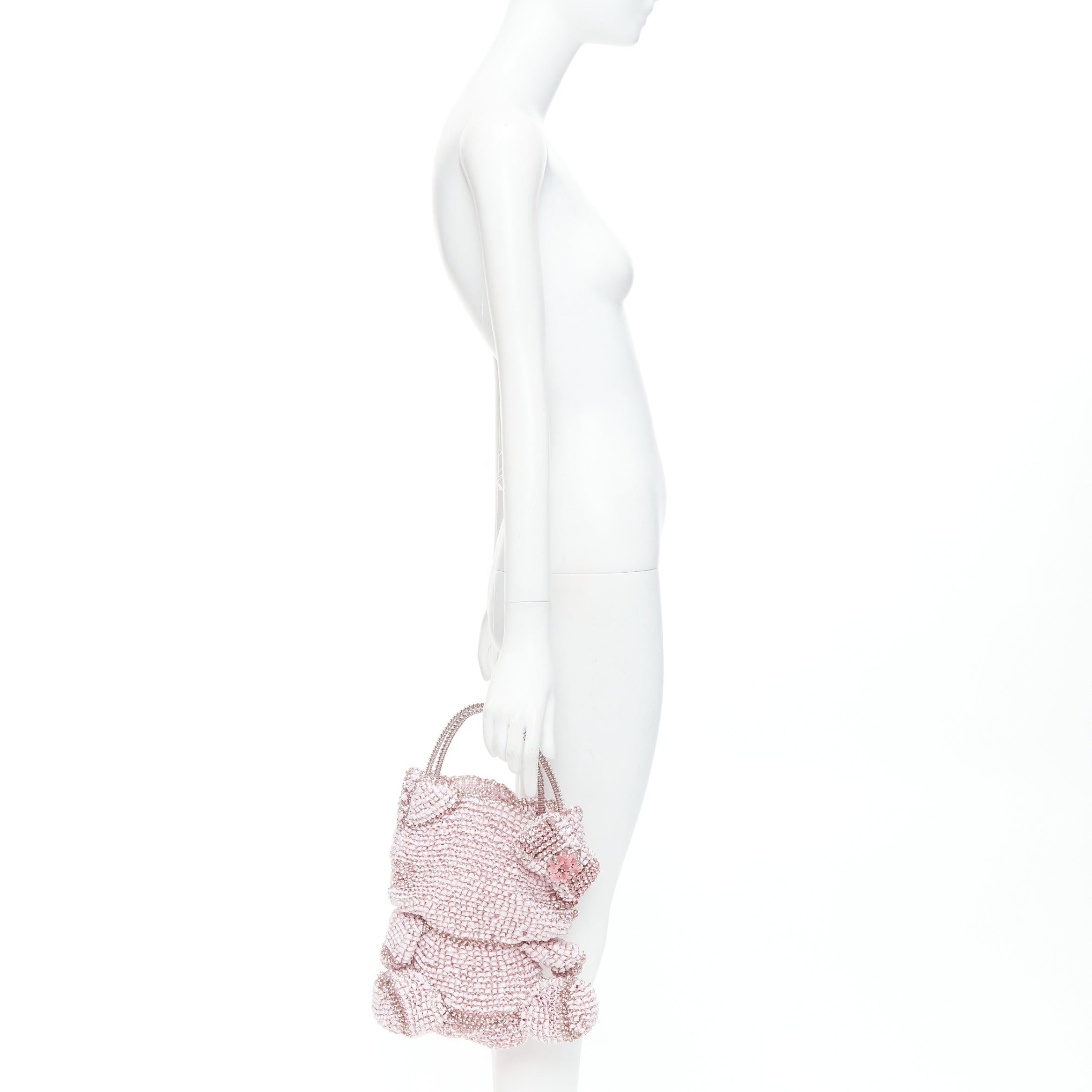 ANTEPRIMA Hello Kitty Sanrio pink PVC wire crystal embellished bag
Reference: TGAS/E00785
Brand: Anteprima
Collection: Hello Kitty
Material: PVC
Color: Pink
Pattern: Solid
Lining: Pink 
Extra Details: Crystal and petal embellished