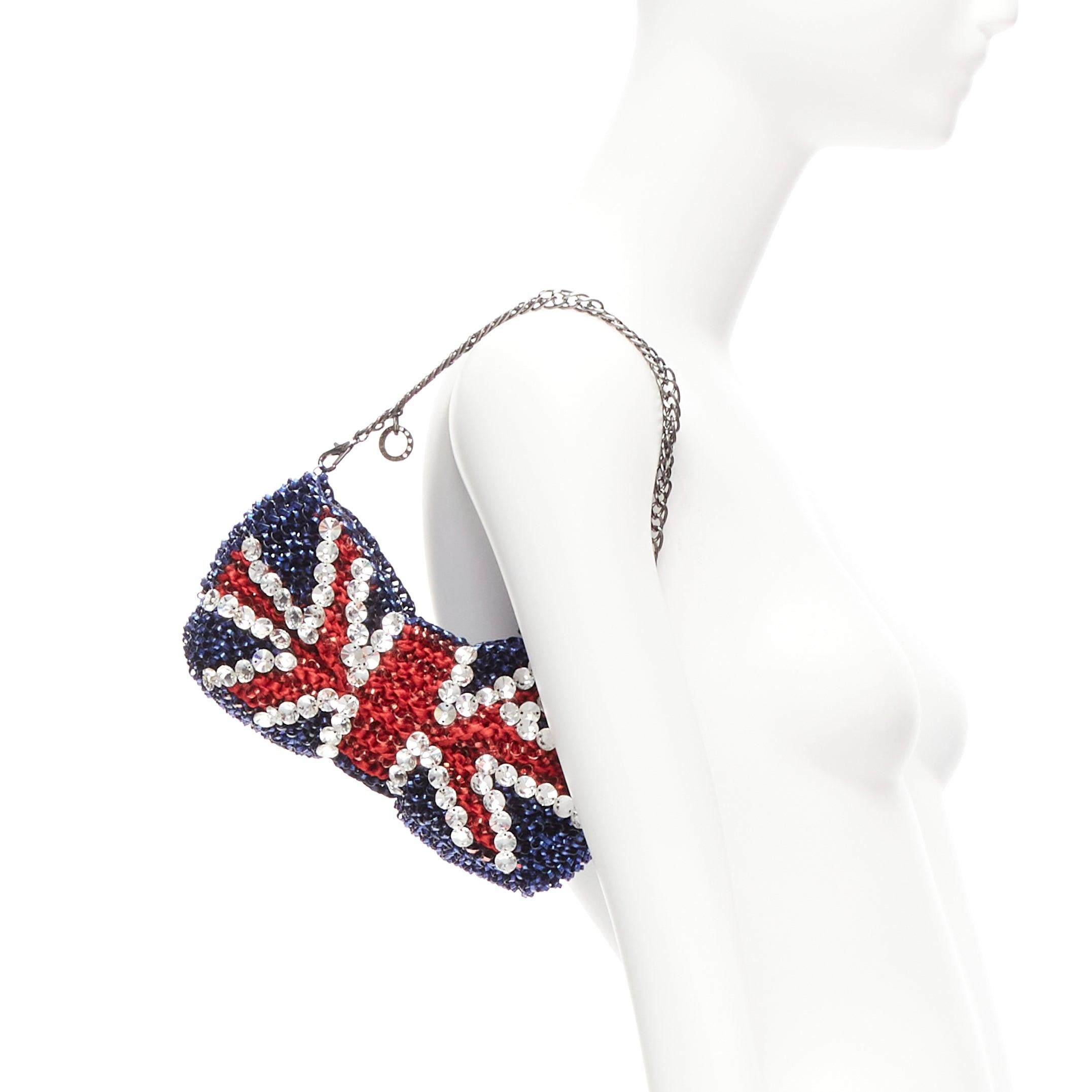 ANTEPRIMA Wire Bag British Union Jack crystal embellished bow clutch
Reference: ANWU/A01067
Brand: Anteprima
Collection: Wire Bag
Material: Plastic
Color: Red, Blue
Pattern: Ethnic
Closure: Zip
Extra Details: Clear crystal embellishments. Crossbody
