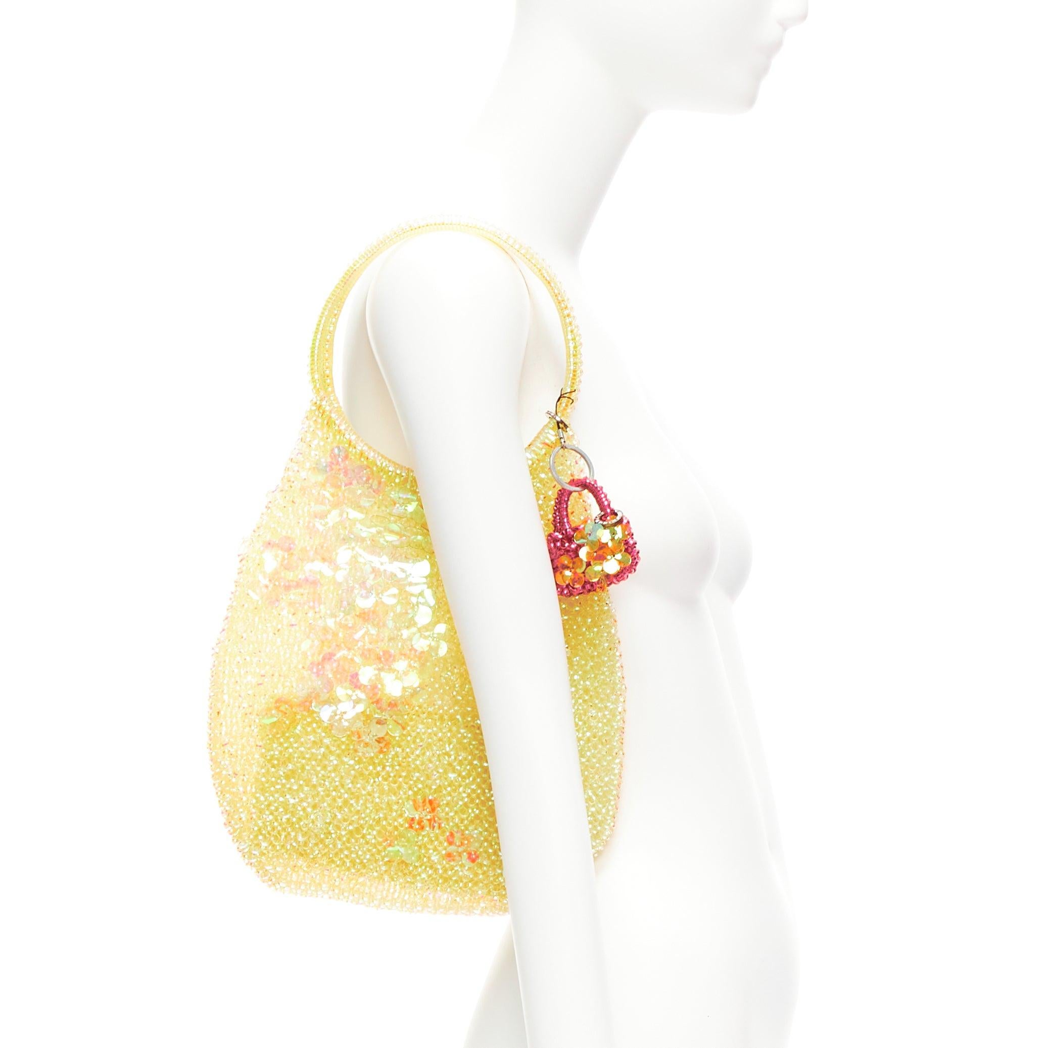 ANTEPRIMA Wire Bag iridescent floral sequins micro charm teardrop tote
Reference: ANWU/A01071
Brand: Anteprima
Collection: Wire Bag
Material: Plastic
Color: Gold, Pink
Pattern: Floral
Extra Details: Pink mini bag phone charm