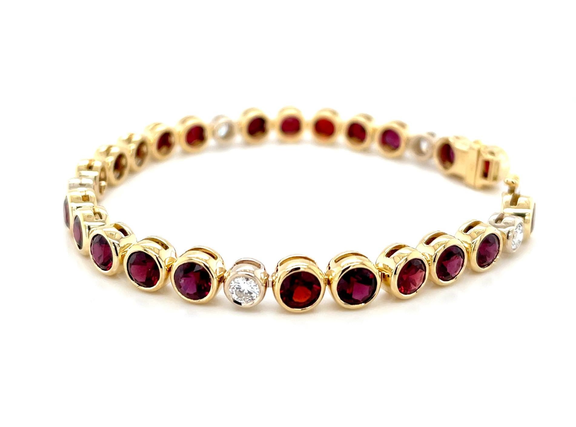 This gorgeous jewel-toned tennis bracelet features over 12 carats of stunning, beautifully matched chrome pyrope garnets set with brilliant round diamonds in 18k yellow gold. Chrome pyrope garnets from Arizona's Anthill Mine are prized for their