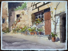 Acquerello impressionista britannico di un cortile fiorito con fascino rustico