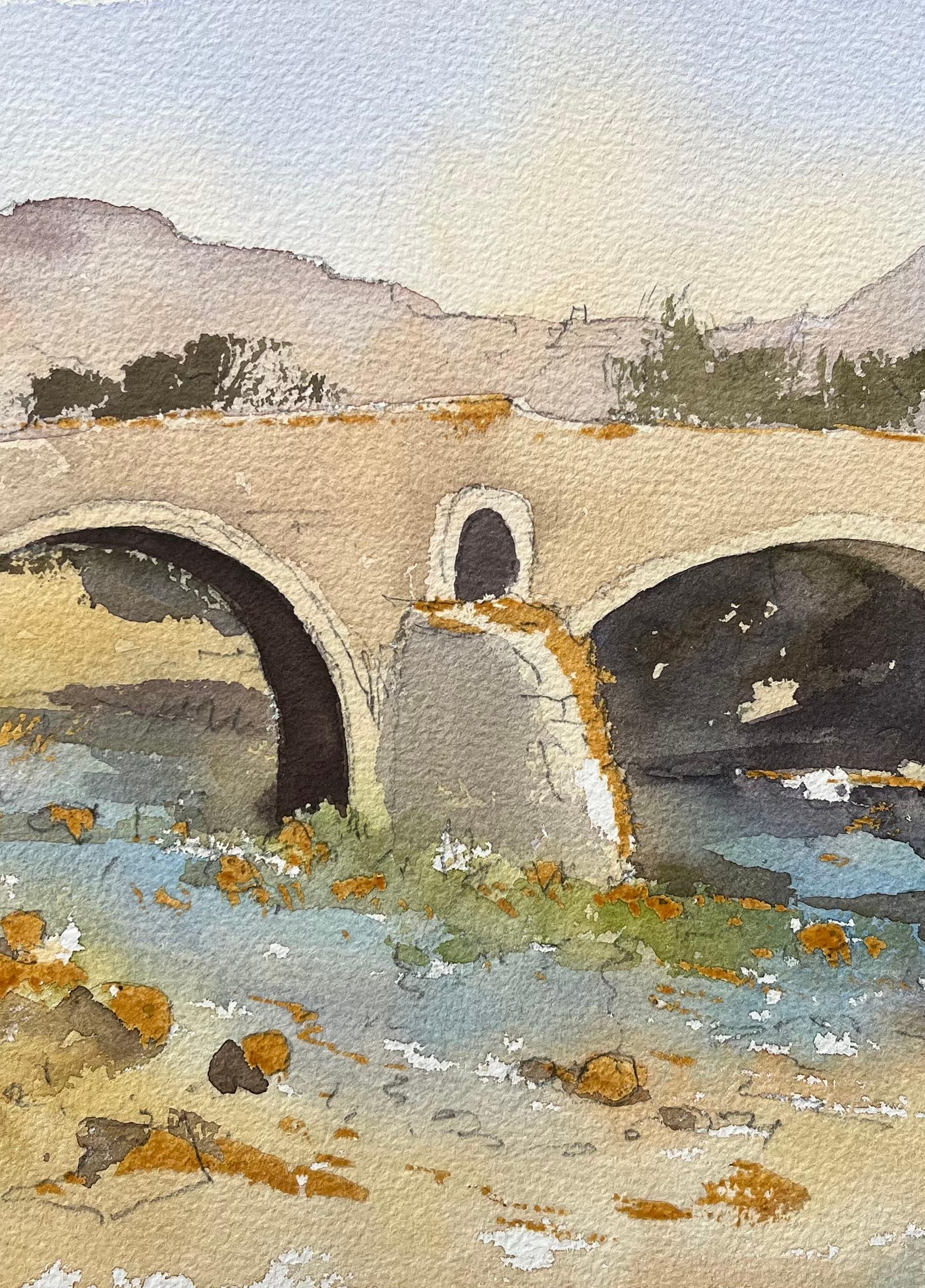 Title: British Impressionist Watercolor of Historic Bridge Over a Stream with Fishermen
by Anthony Avery (British 1946-2023)
Original watercolor on artists paper, unframed
Dimensions: 11.25 x 15.25 inches (Height x Width)
Condition: Good, with some