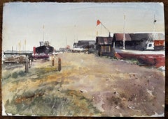 Coastal Boatyard with Fishing Huts Beached Boats and Red Flag Watercolour Scene