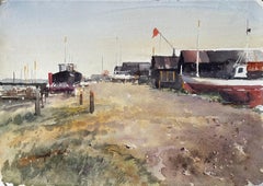 Coastal Boatyard with Fishing Huts Beached Boats and Red Flag Watercolour Scene