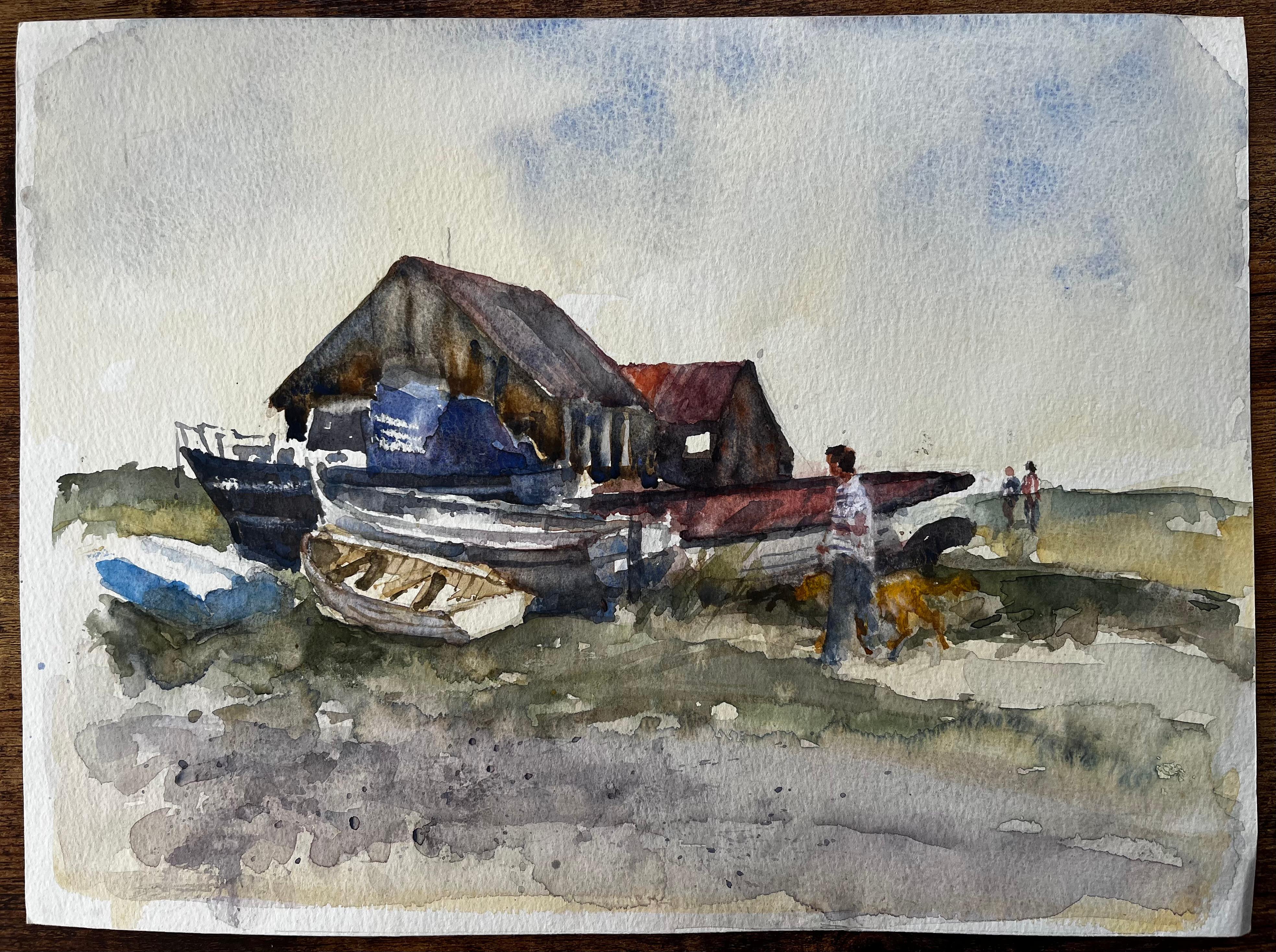 Viejo astillero con figuras y perro en la costa de Suffolk Acuarela de Tony Herbert - Painting de Anthony Herbert