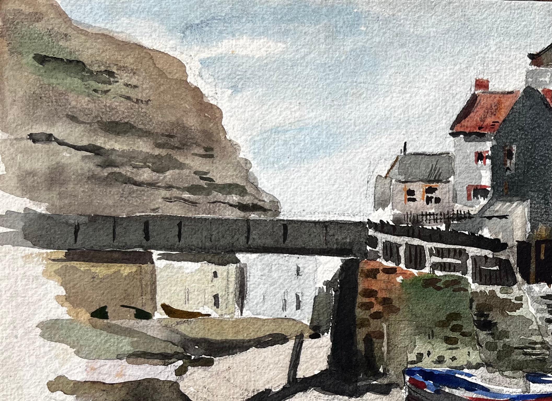 Title: Staithes Harbour with Boats and Red Roofed Cottages North Yorkshire Coast
By Tony Herbert (1927-2024)
Medium: Watercolor on paper, unframed
Size: 8.75 inches (height) x 13.25 inches (width)
Condition: good, with some signs on wear consistent