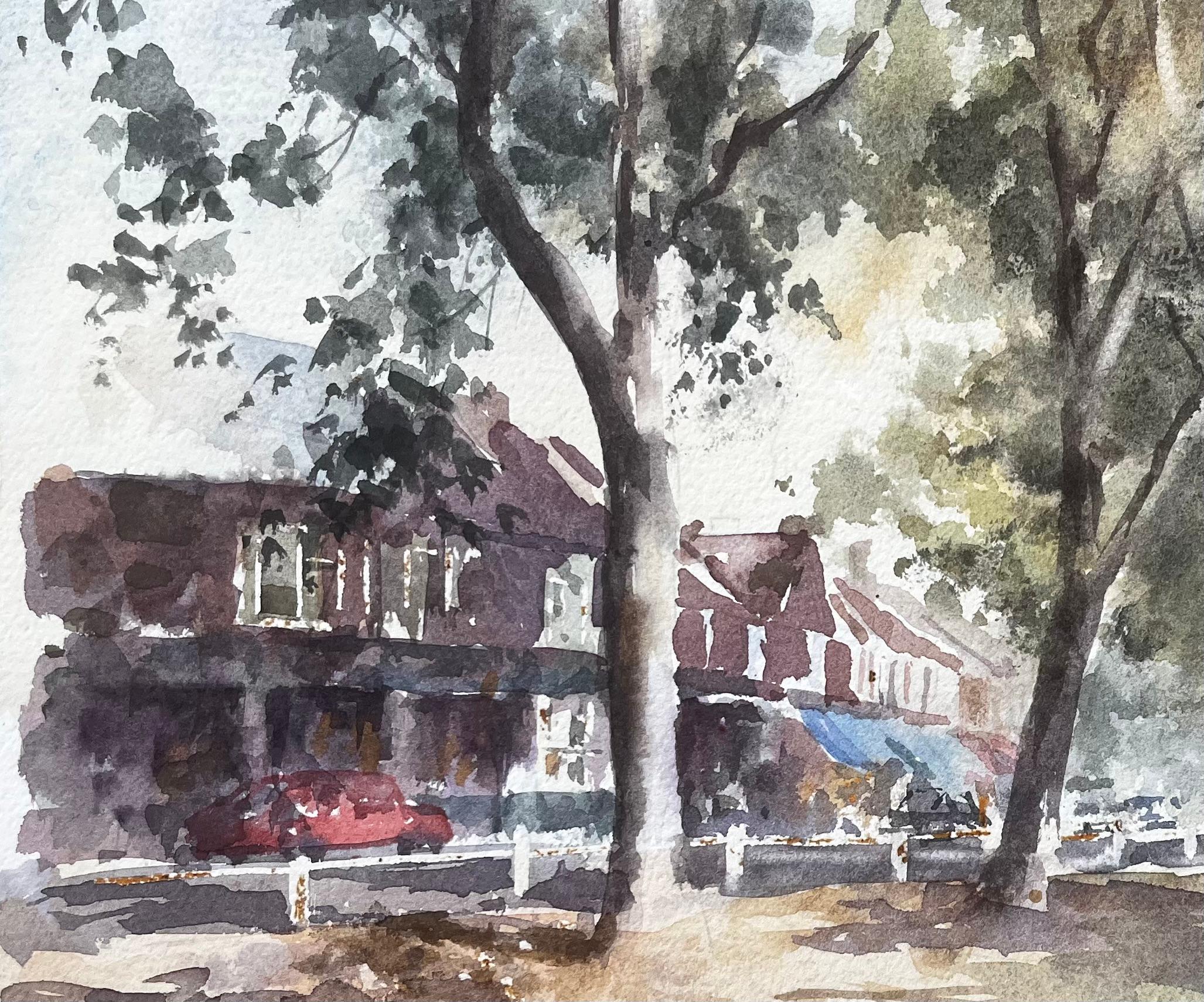 Von Bäumen gesäumte Straße mit Geschäften und rotem Auto West Londoner Vorstadt-Aquarell-Szene (Impressionismus), Art, von Anthony Herbert