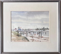 Walberswick Tidal Estuary with a Long Wooden Pier Stretching Across the Mudflats