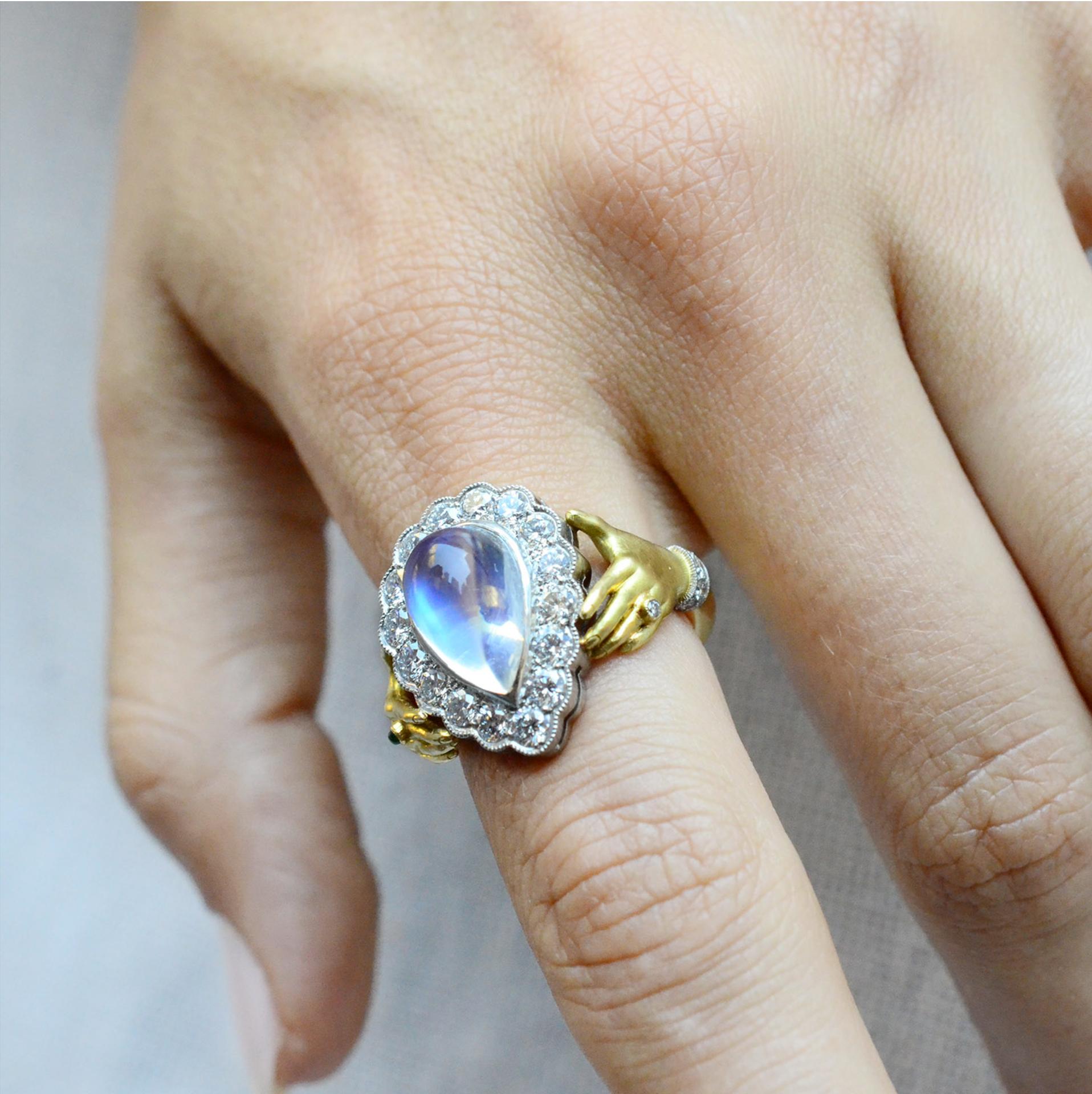 Artisan Anthony Lent Rainbow Moonstone Diamond Emerald Platinum Gold Adorned Hands Ring