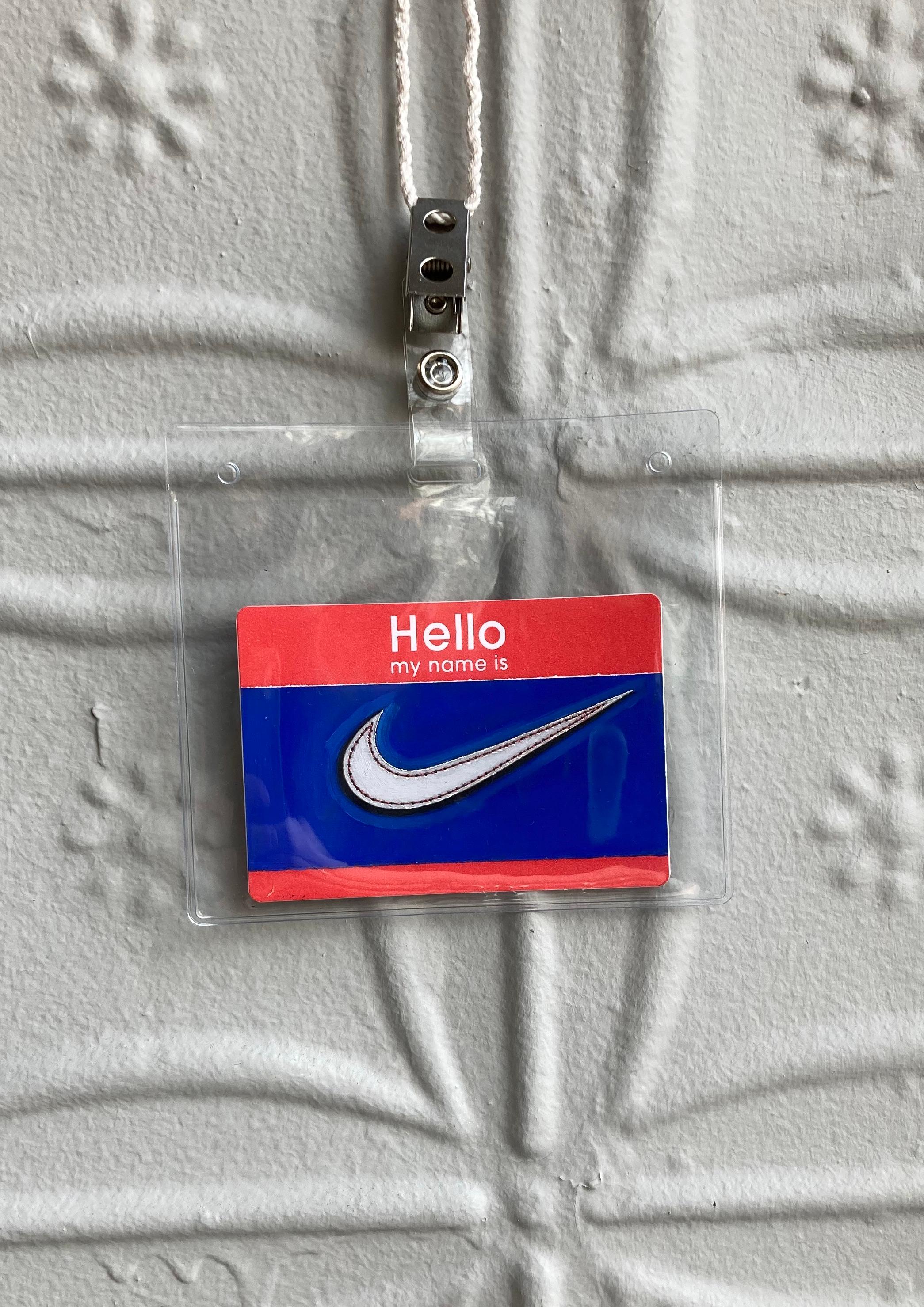 Hallo, mein Name ist: Nike - Miniatur-Piktogramm auf Papier – Painting von Anthony Mastromatteo