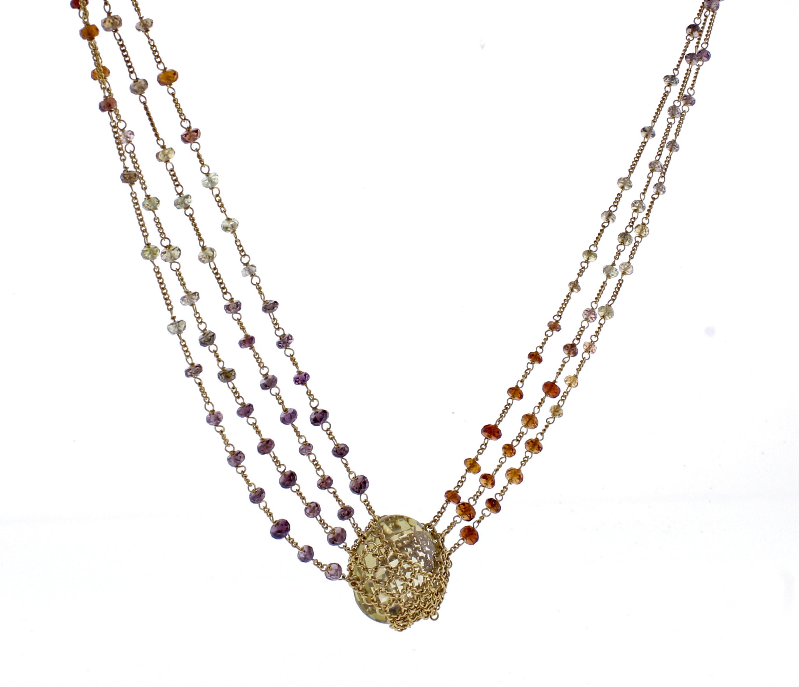 From World-famous jewelry designers Anthony Camargo and Nak Armstrong,  a handmade  lemon citrine and amethyst necklace.  The 18 karat necklace contains a center pear-shape briolette  lemon citrine. The  7 chains are highlighted by citrine, lemon