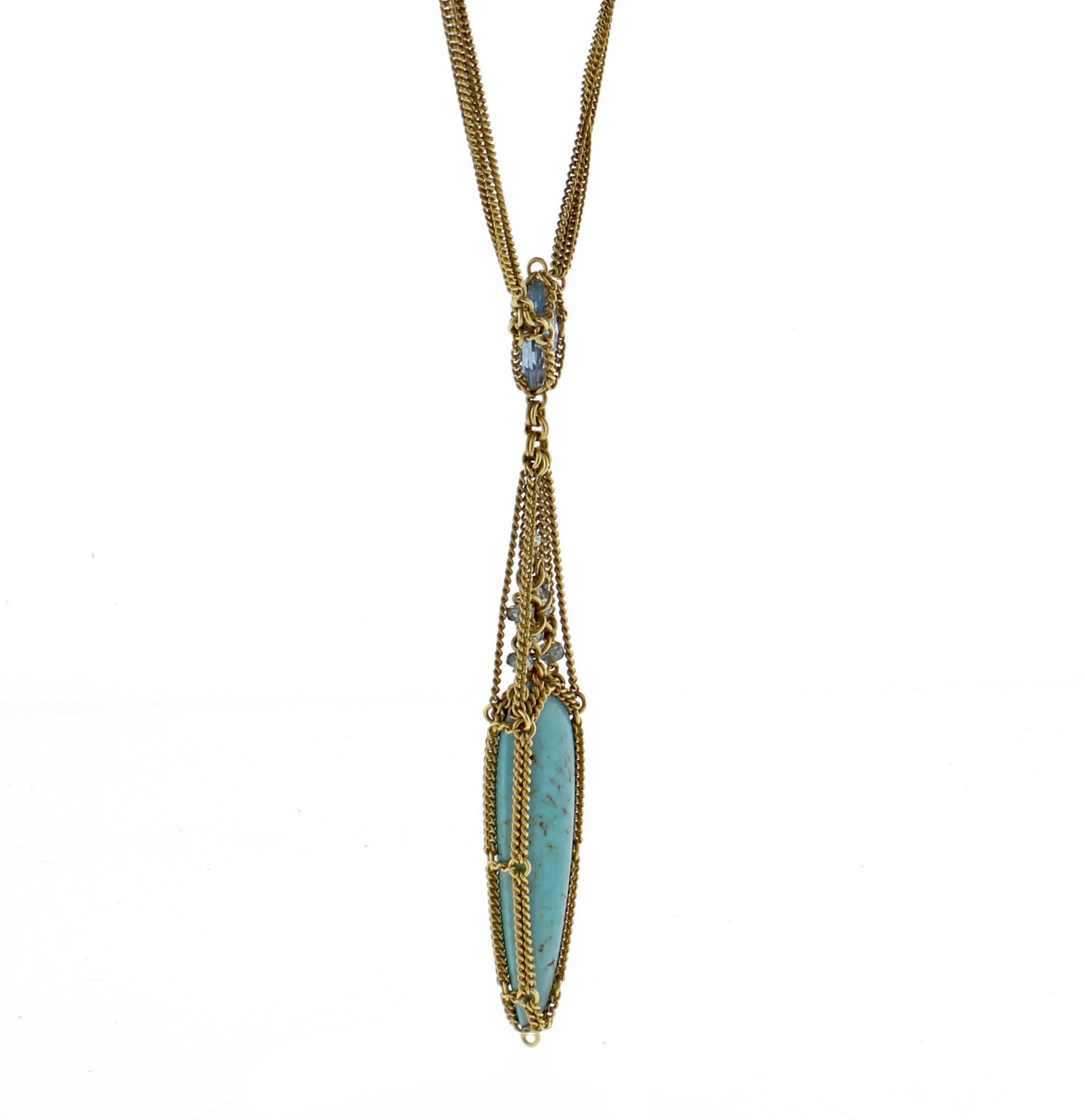 From World-famous jewelry designers Anthony Camargo and Nak Armstrong, this handmade 18 karat natural south west turquoise and blue topaz necklace. The over all drop measures 3 inches with the  turquoise measures  1 ¼ high and 7/16 of and inch wide.
