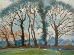 modern British Landscape with fields, trees and sheep grazing