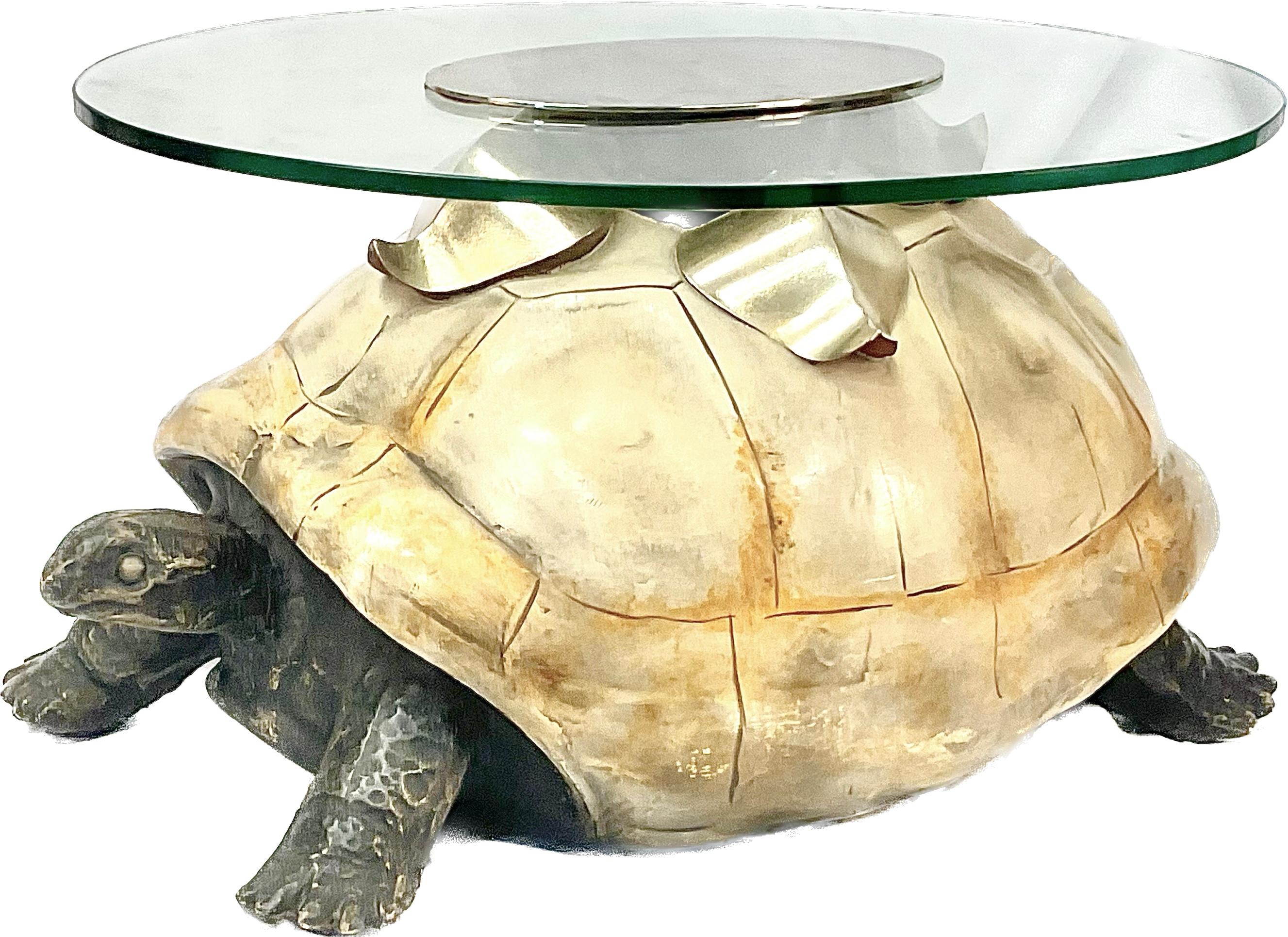 A coffee table by Anthony Redmile, London, circa 1970. Base of the table is fashioned from composite painted turtle under a circular glass top with center plaque.