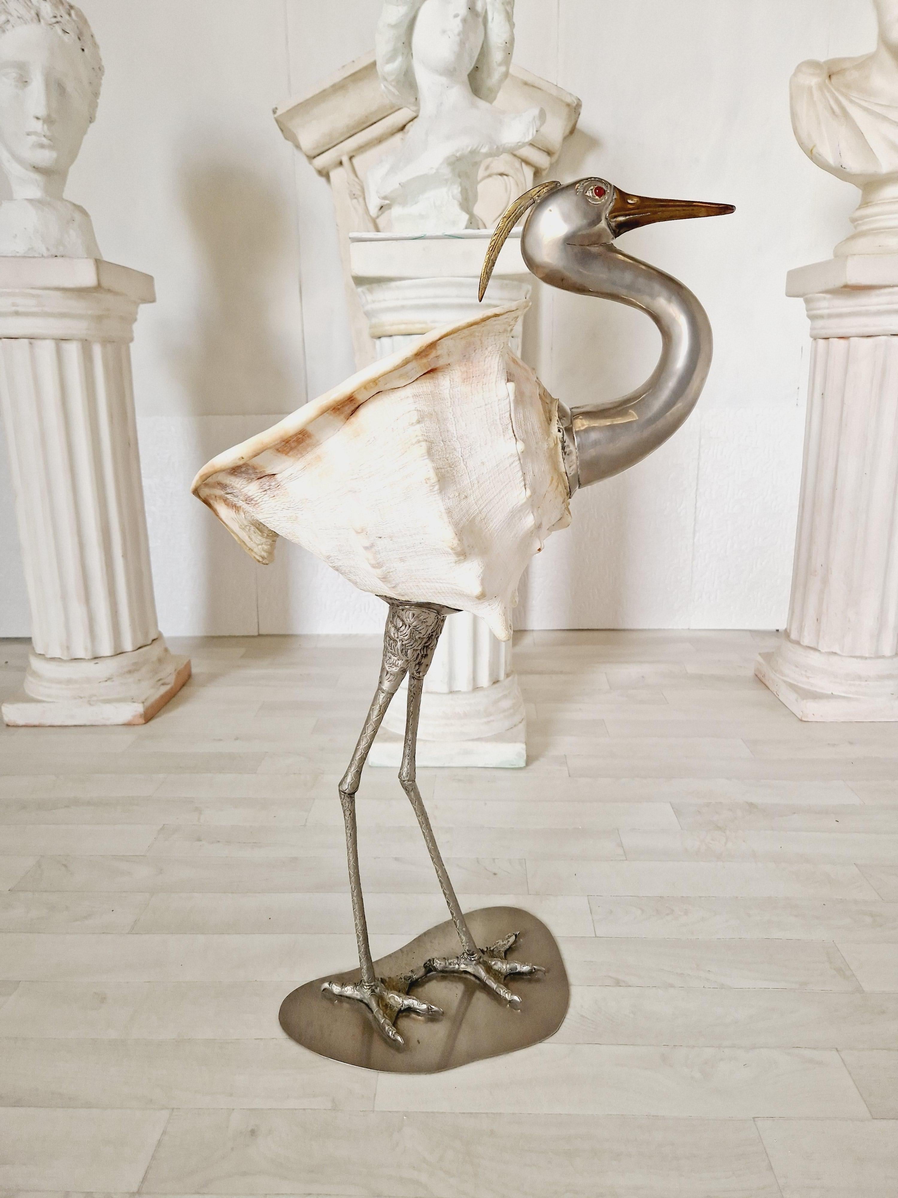 This exquisite Stork sculpture by Anthony Redmile is a stunning piece of contemporary art that captures the beauty of birds using a large sea shell for the body. Made in 1970, this limited edition sculpture is a single piece made entirely by hand