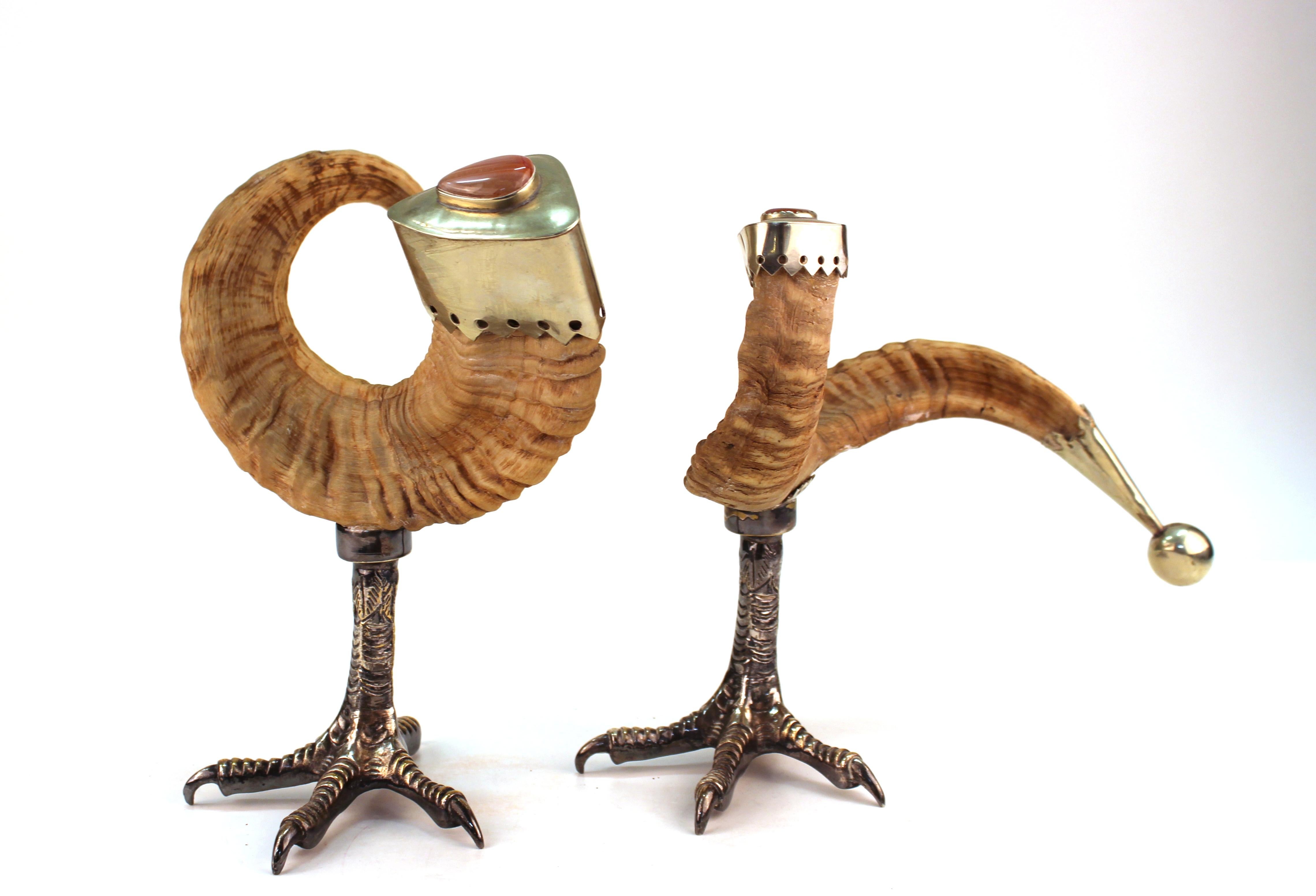 Anthony Redmile Mid-Century Modern decorative ram horns with silver-plated caps and rhodocrosite cabochons. The horns have ball ends and are mounted atop eagle claw feet.