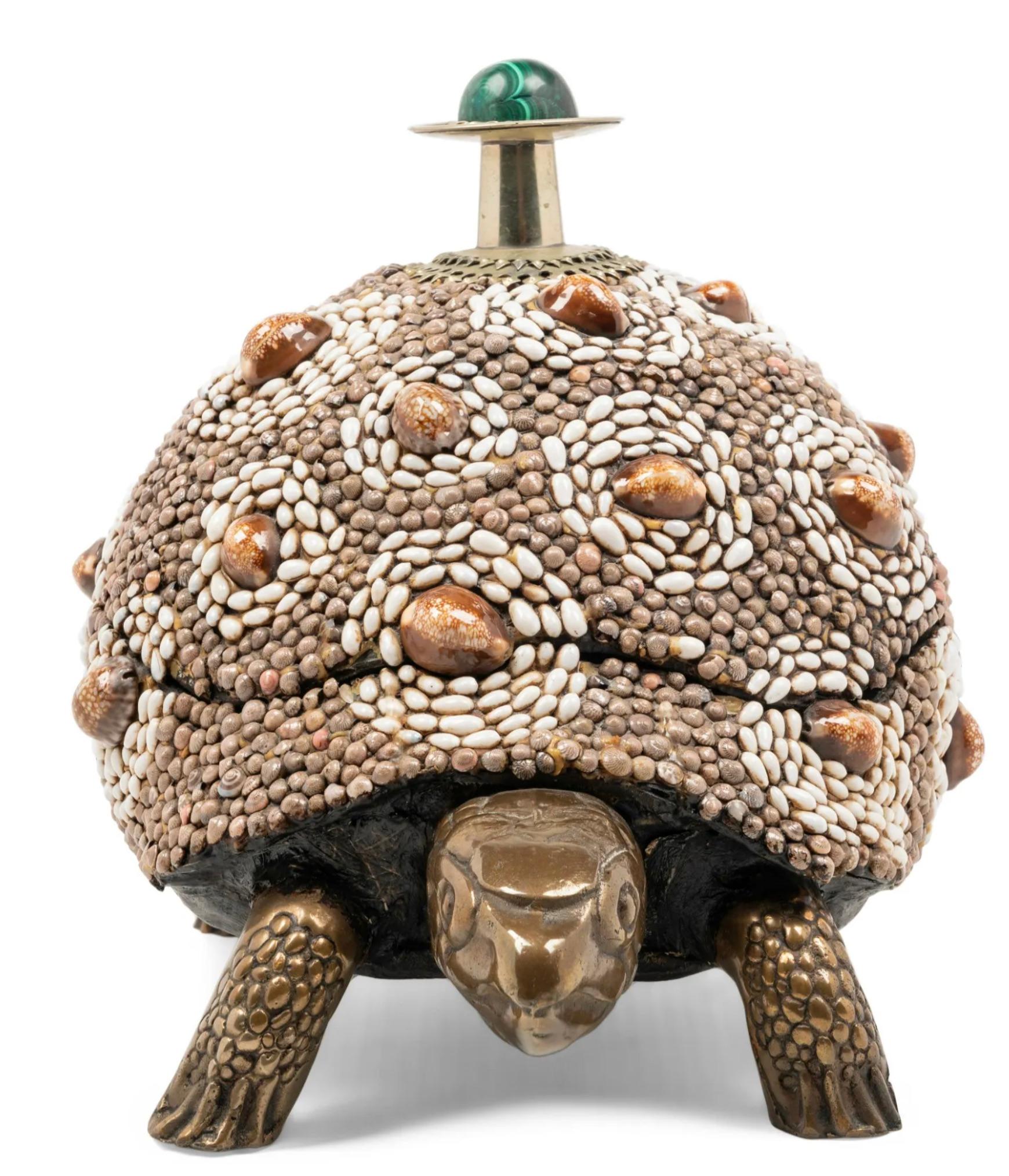 A great example of this form with head and legs in bronze metal 
and the body encrusted with sea shells.

