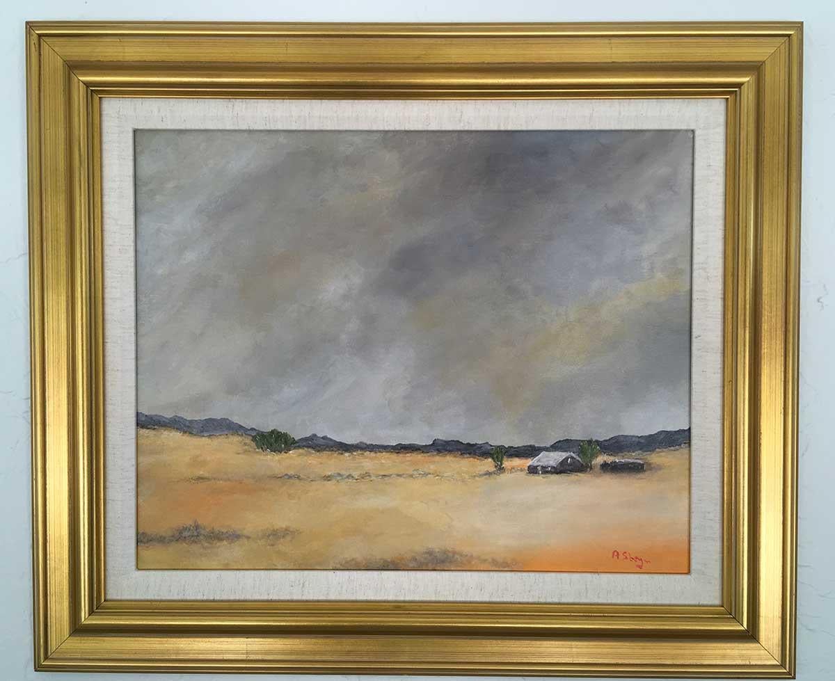 In this framed 17.5" x 29.5" Acrylic on Canvas Board Painting by Anthony Steyn, the artist has has created a warm sunrise landscape painting of his homeland in Karoo, South Africa.  The deep orange sky along the horizon peeks behind a "kopie" (hill)