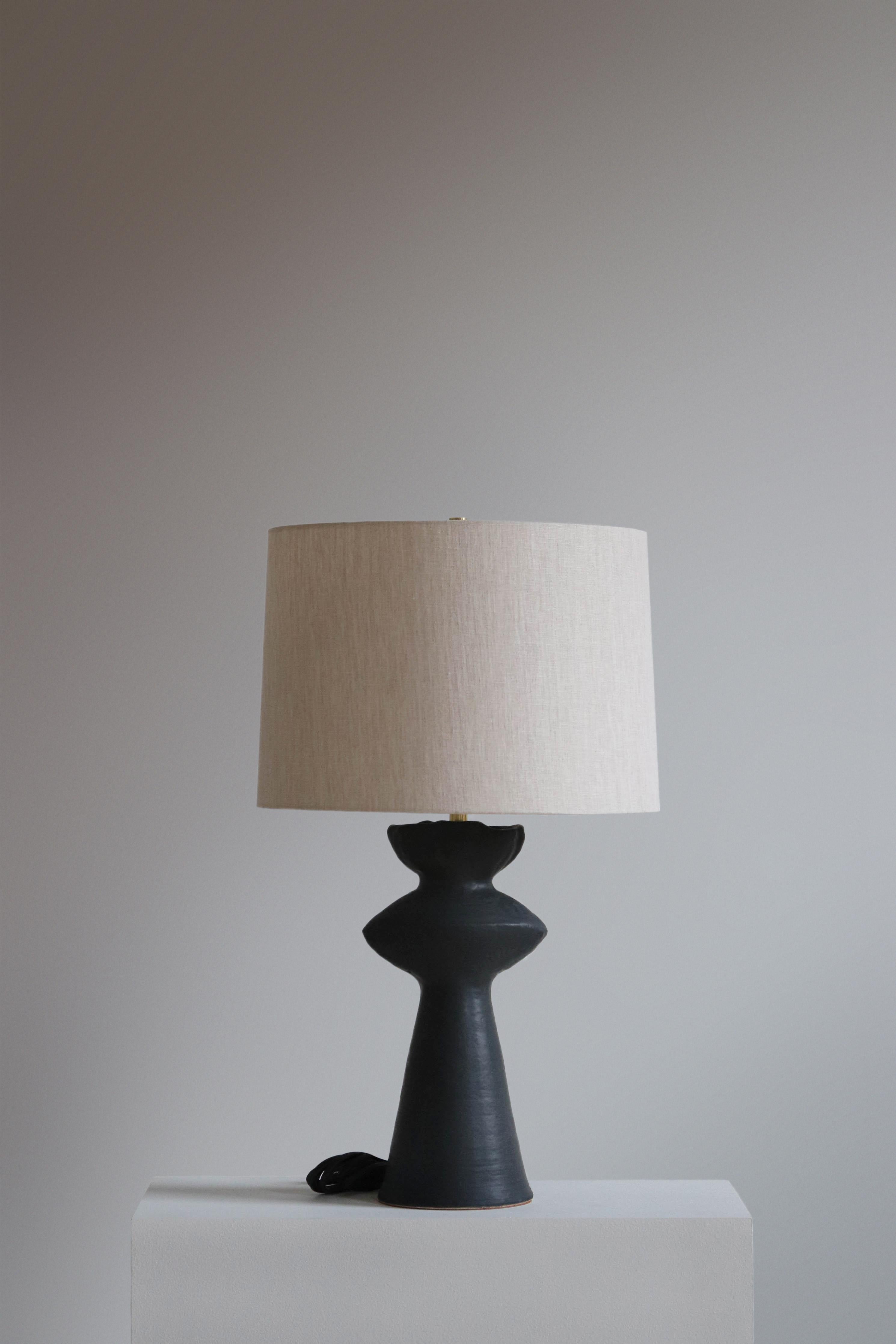 Anthracite Cicero 26 Table Lamp by  Danny Kaplan Studio
Dimensions: ⌀ 41 x H 66 cm
Materials: Glazed Ceramic, Unfinished Brass, Linen

This item is handmade, and may exhibit variability within the same piece. We do our best to maintain a consistent