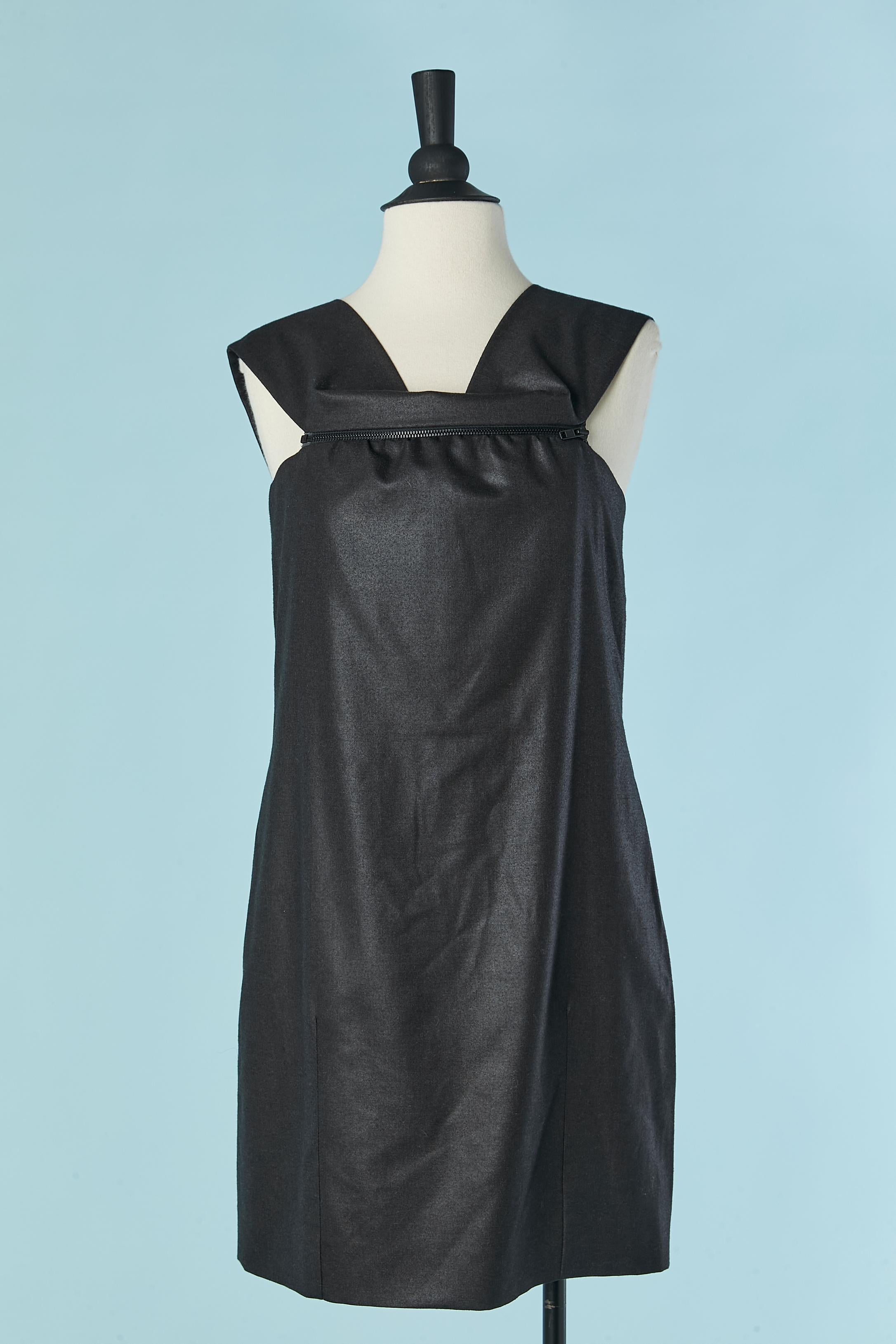 Anthracite grey wool sleeveless dress with zip on the bust. Main fabric composition: 98% wool, 2% stretch. 
Silk boned bustier inside the dress with zip and hook&eye closure. Invisible zip on the top to close the dress.
SIZE 38 / M 