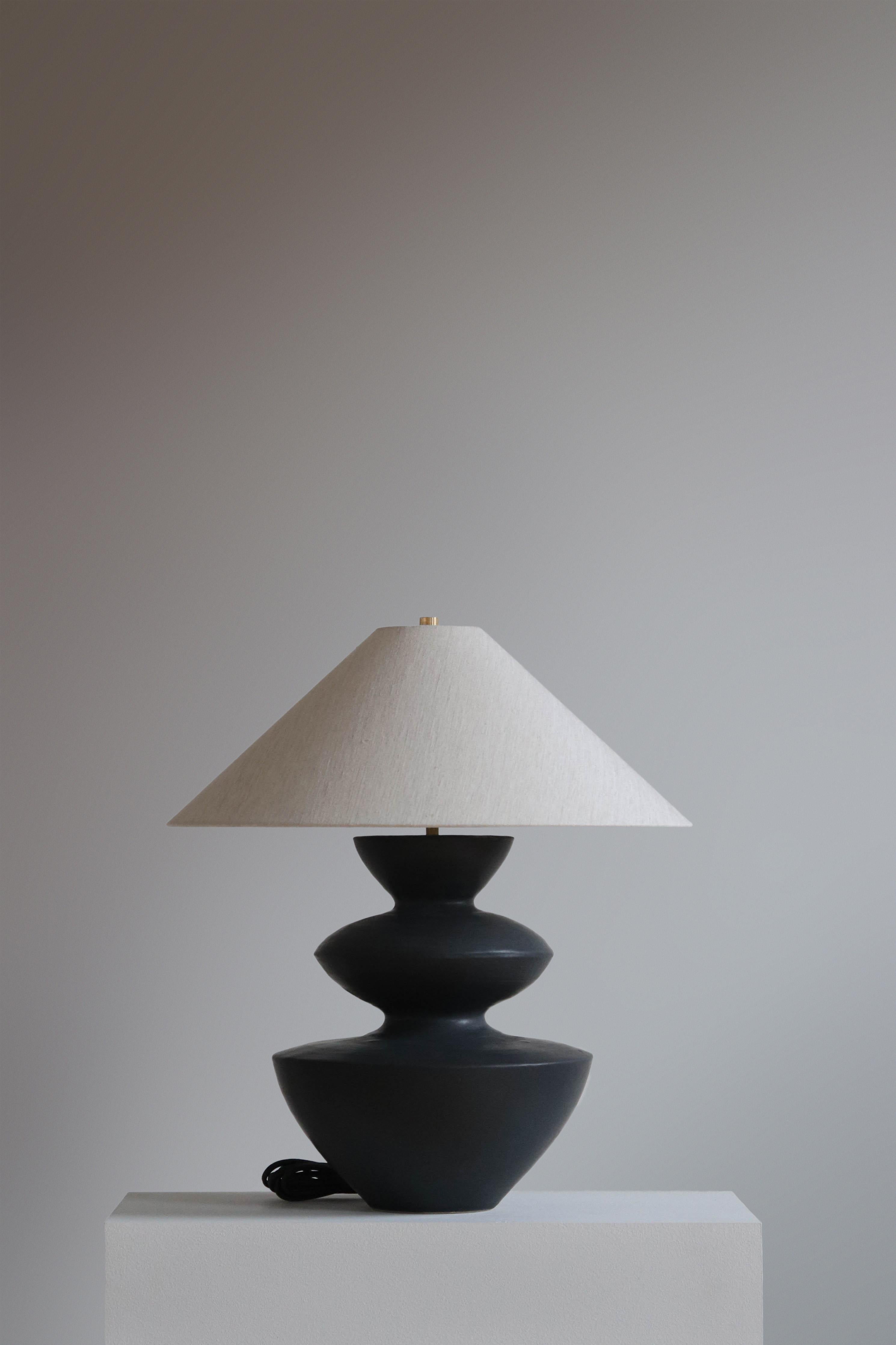 Anthracite Janus Table Lamp by Danny Kaplan Studio
Dimensions: ⌀ 51 x H 59 cm
Materials: Glazed Ceramic, Unfinished Brass, Linen

This item is handmade, and may exhibit variability within the same piece. We do our best to maintain a consistent