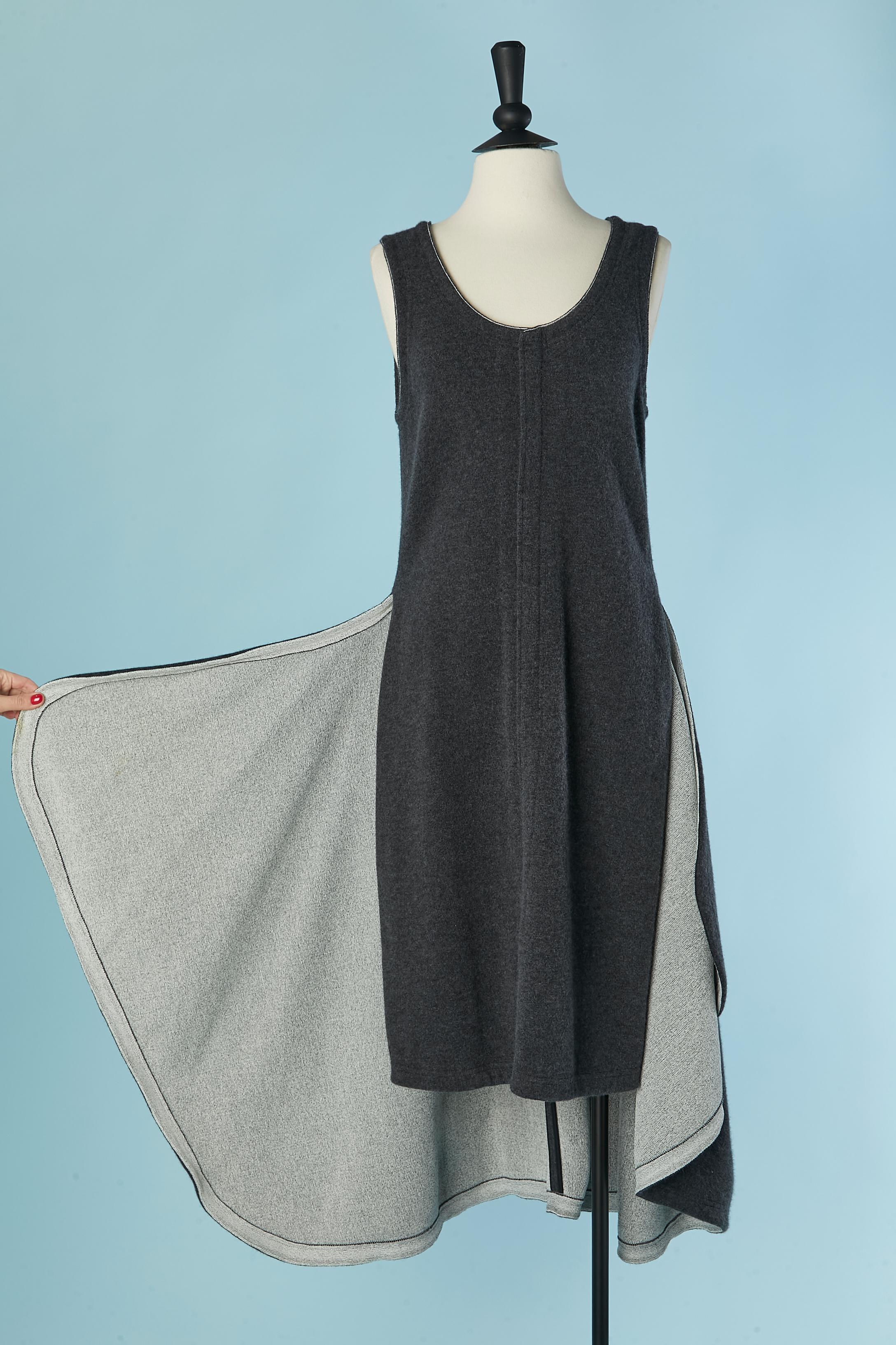 Anthracite knit dress open on the side and longer on the back. Knit composition: 45% wool, 24% rayon, 13% polyamide, 12% angora, 5% polyester, 1% elastane 
Zip closure on the middle back. 
Total front lenght: 102cm
Total back lenght: 126cm
Size 38