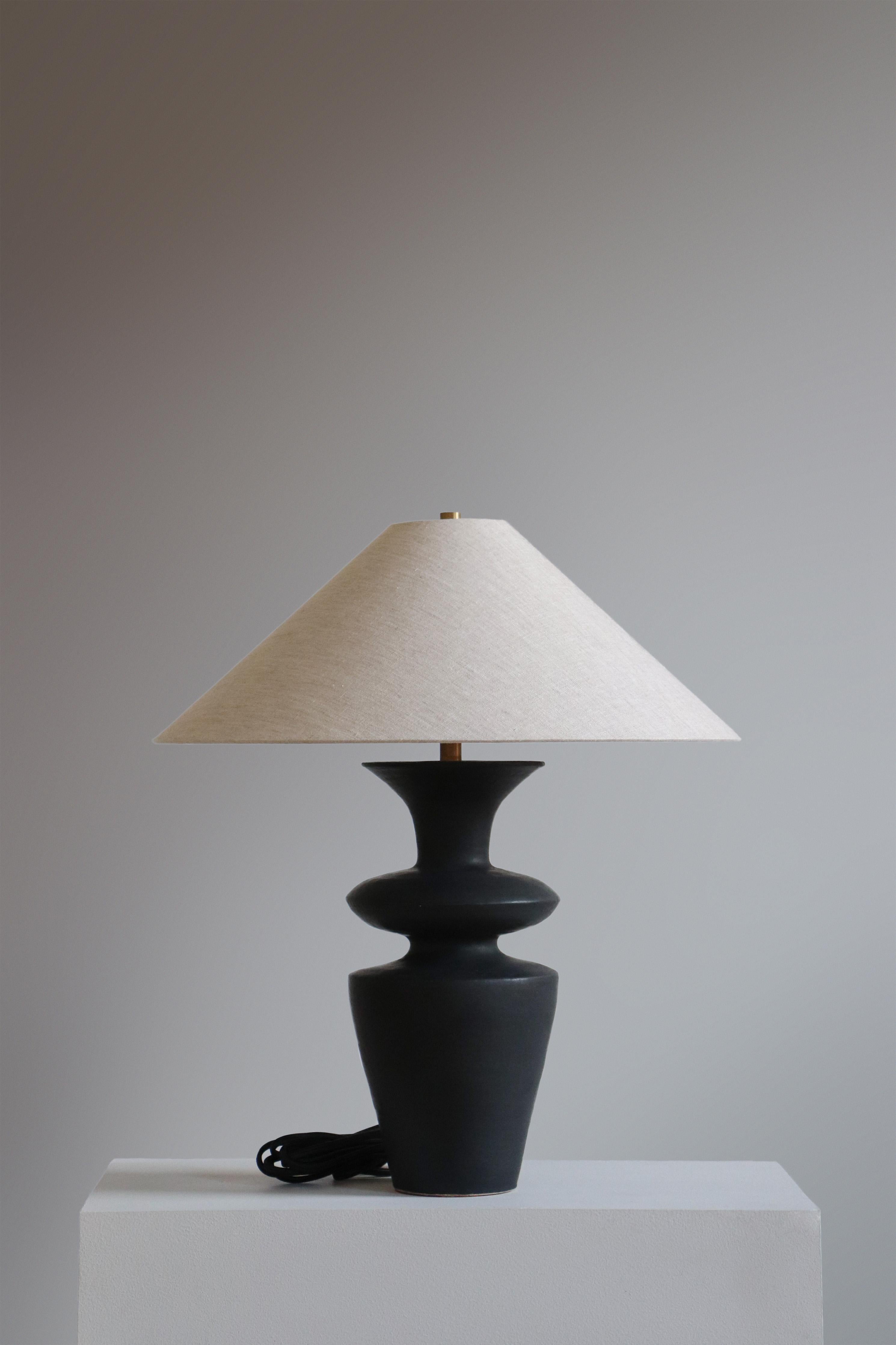 Anthracite Rhodes Table Lamp by Danny Kaplan Studio
Dimensions: ⌀ 51 x H 69 cm
Materials: Glazed Ceramic, Unfinished Brass, Linen

This item is handmade, and may exhibit variability within the same piece. We do our best to maintain a consistent
