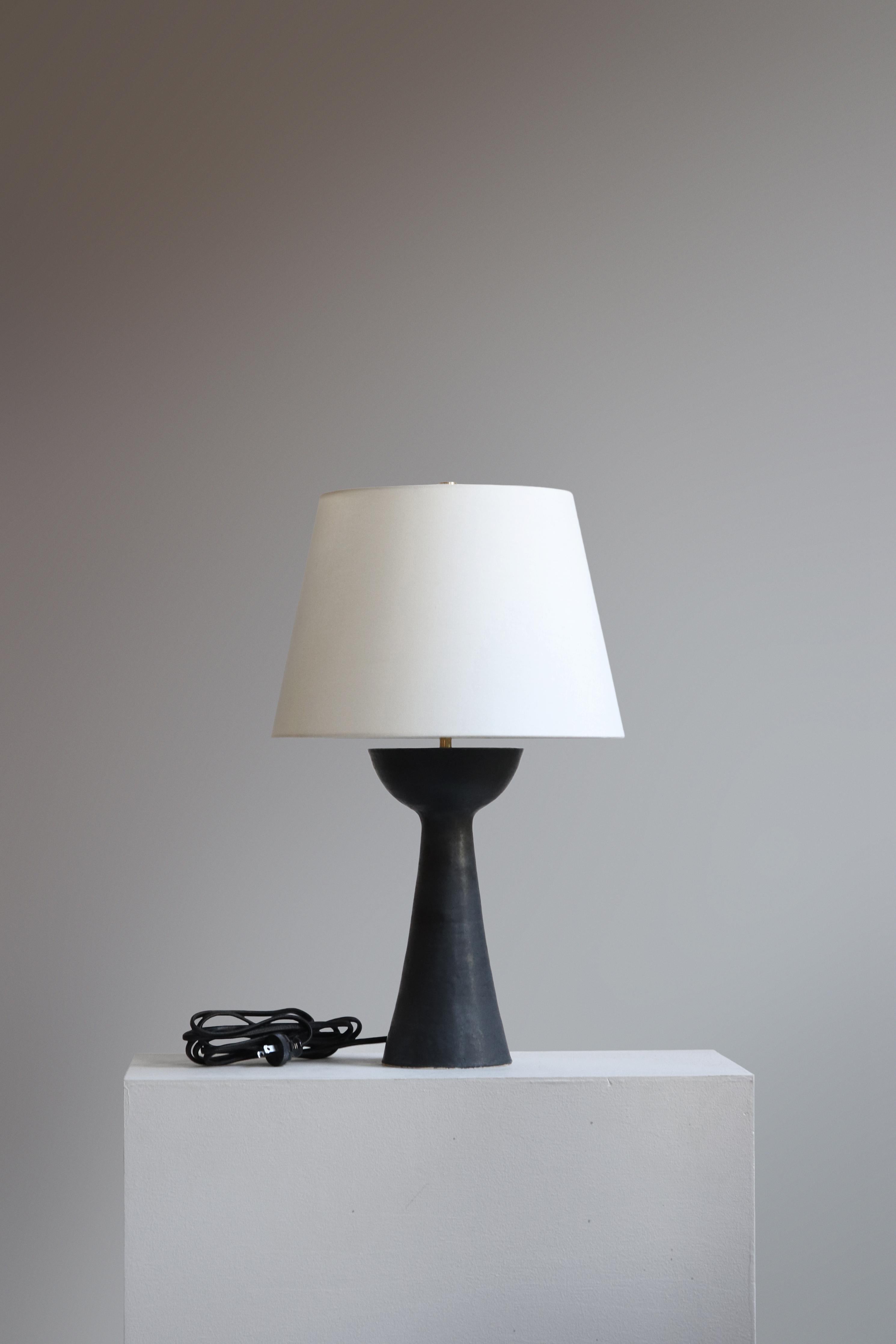 Anthracite Seneca 21 Table Lamp by Danny Kaplan Studio
Dimensions: ⌀ 36 x H 54 cm
Materials: Glazed Ceramic, Unfinished Brass, Linen

This item is handmade, and may exhibit variability within the same piece. We do our best to maintain a consistent