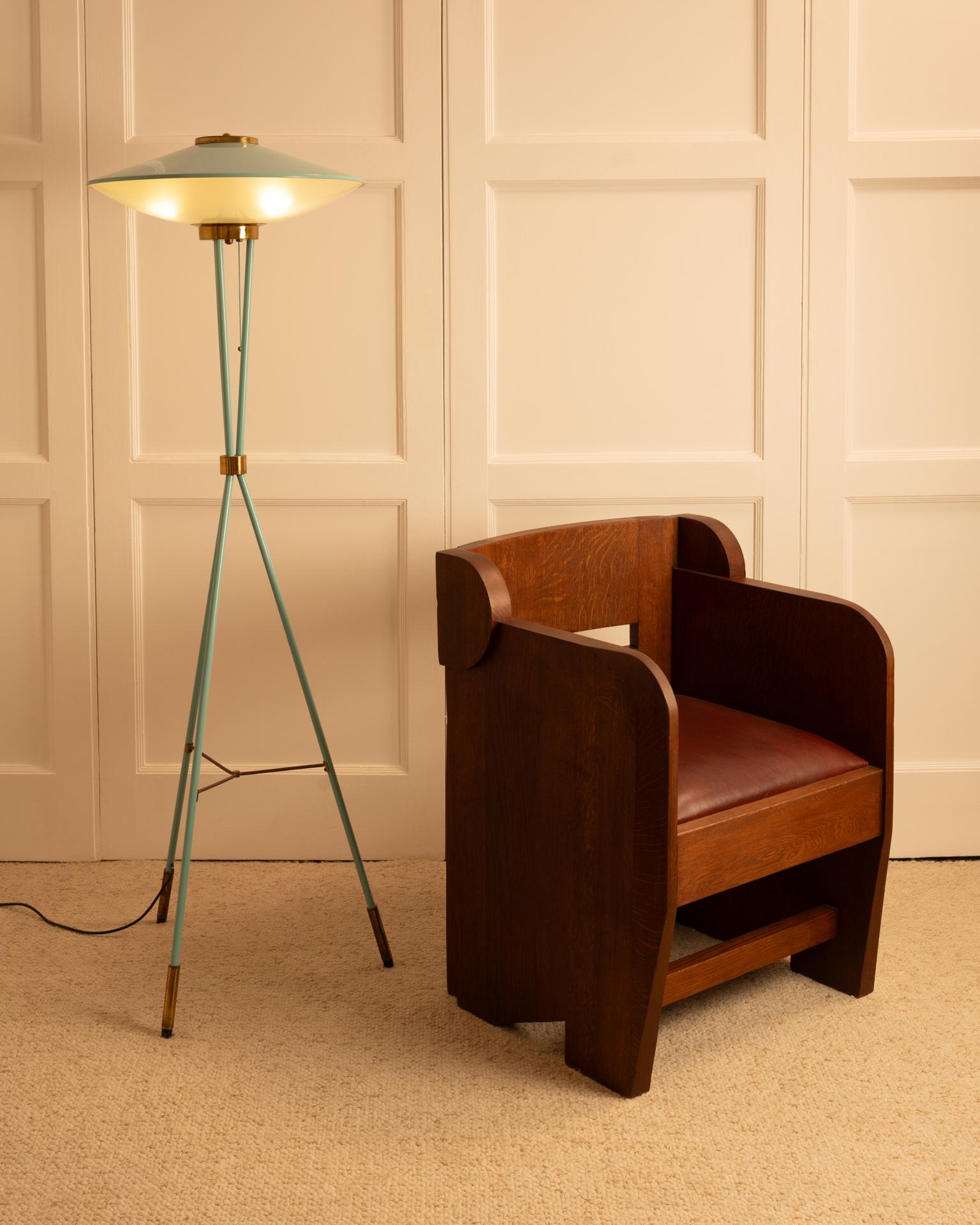 Pair of sculptural oak armchairs, early 20th century, Netherlands, with anthroposophical design reminiscent of the Amsterdam School. Fully restored, with burgundy red leather seats.