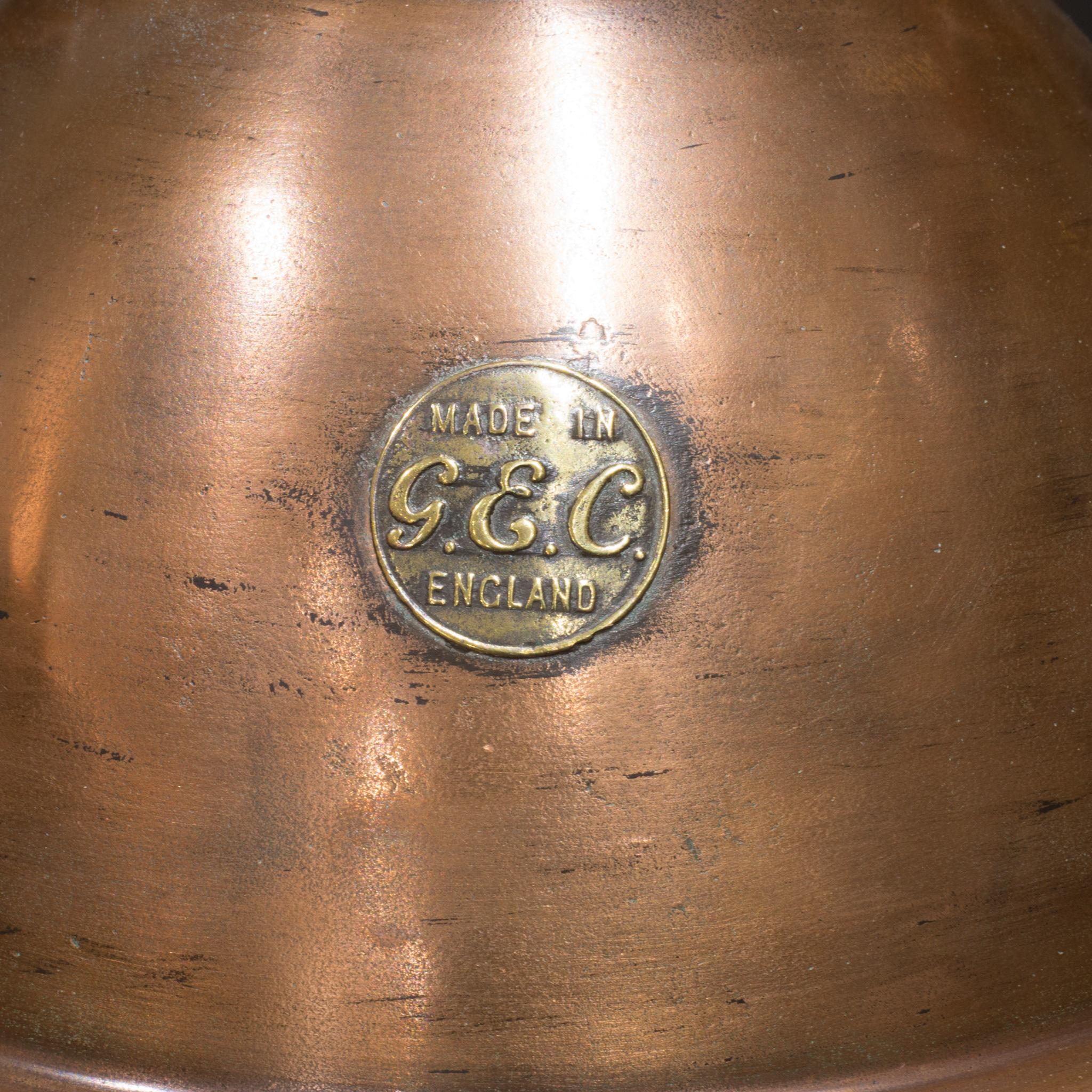 About
An antique spun copper pendant lamp with embossed brass maker's plaque and original GecoRay mirrored reflector inside. Manufactured by the General Electric Company.
Rewired.

 Creator General Electric Co., England. 
Date of manufacture