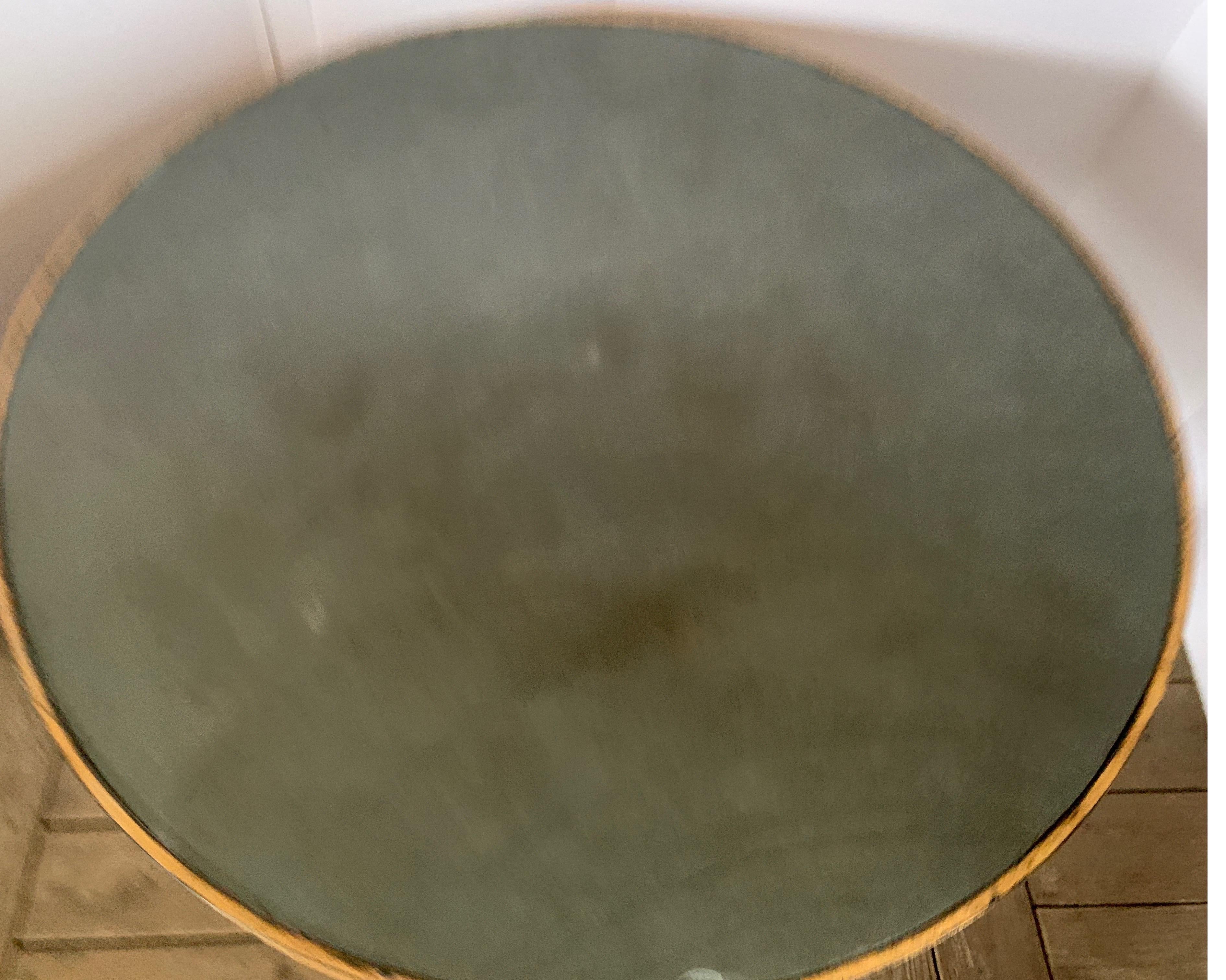 This is one of our own production that we have made at our factory in Europe. This is a very heavy iron with gilt over in gold and greenish gray slate top. The gold is meant to be distressed to look like it has age but of course is new. The same
