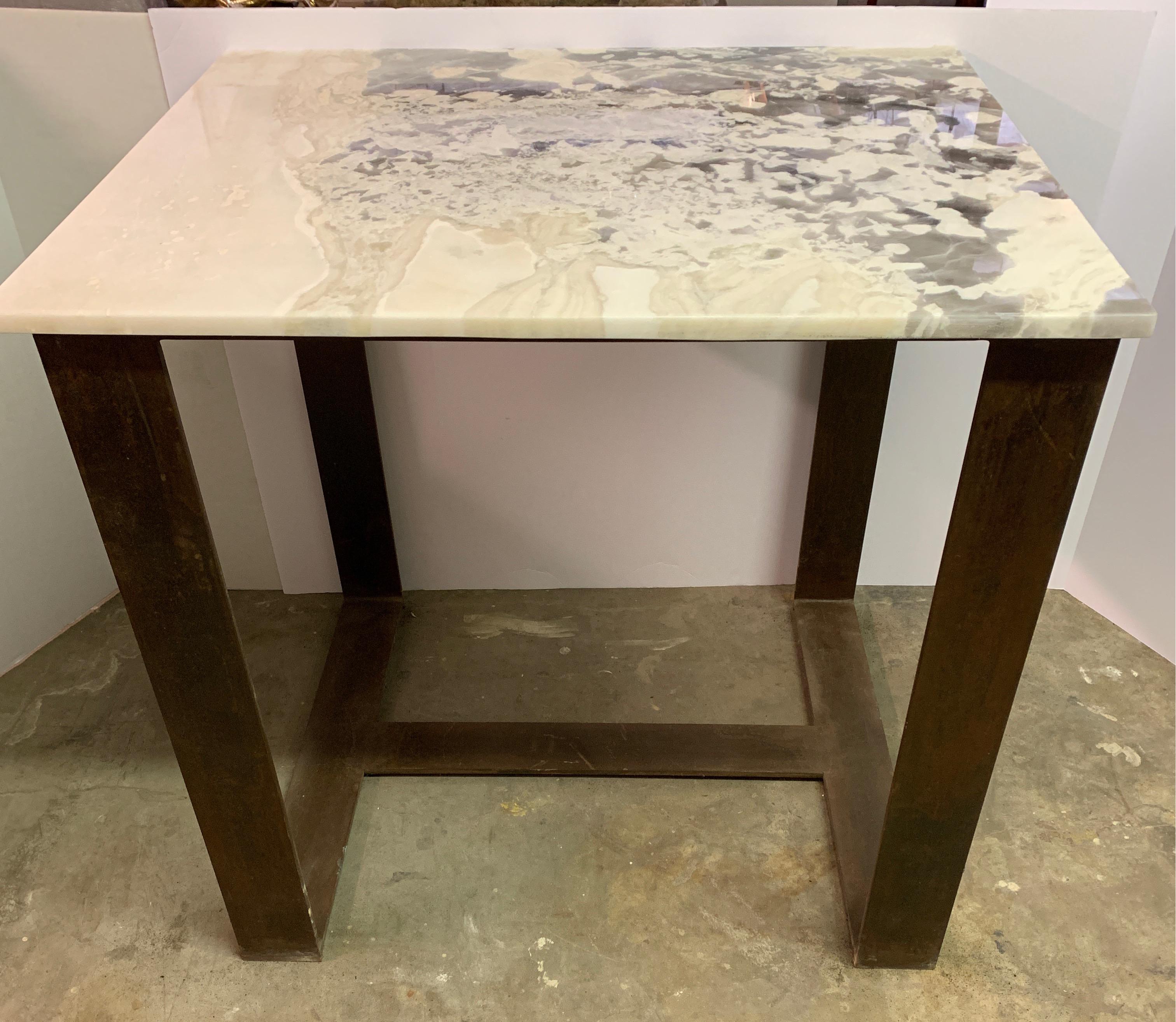 This is one of our own fabrications from our workshop in Europe. It’s nicely handcrafted with 4 inch wide x 3/8 inch thickness iron and exotic quartz top. This is a great piece for that small area kitchen where you’d like an island or perfect to
