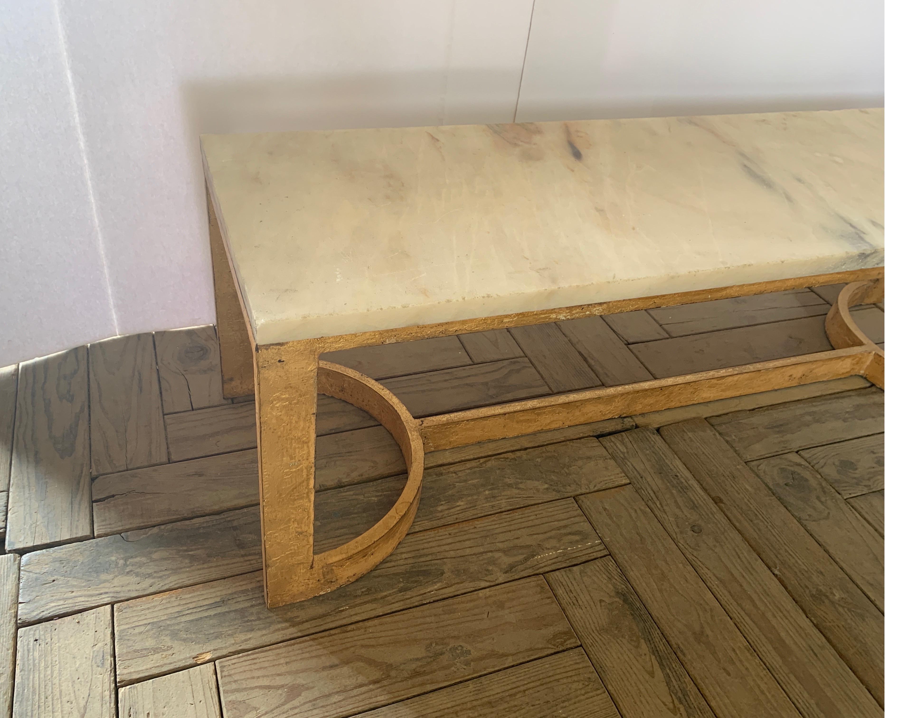 This is our own heavy duty iron rectangular coffee table with vintage one inch marble top. It has a gold distressed finish and great for a cocktail table as well.